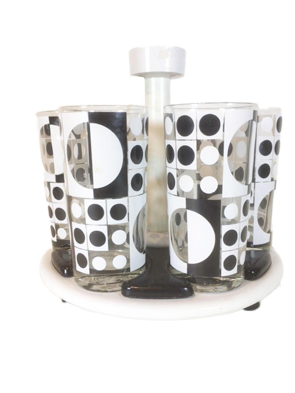 Six vintage highball glasses with a black and white geometric Op-Art design on clear glass. The enamels, combined with the clear glass use circles and squares in various sizes and arrangements to create graphic patterns. This set comes complete with