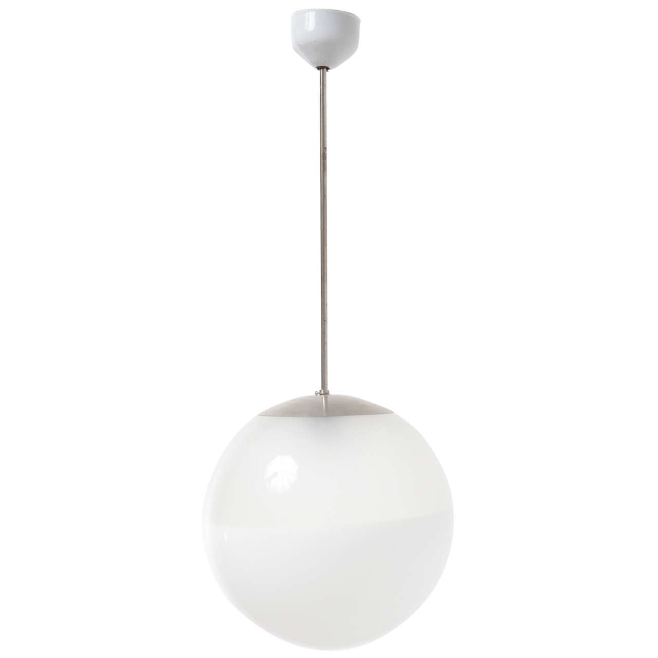 A transparent part at the top of the diffuser lets the light indirectly transfer outside. The bottom part of the diffuser is finished in white opaline glass. It is handcrafted using Murano glass and is equipped with an E26 light source. It provides