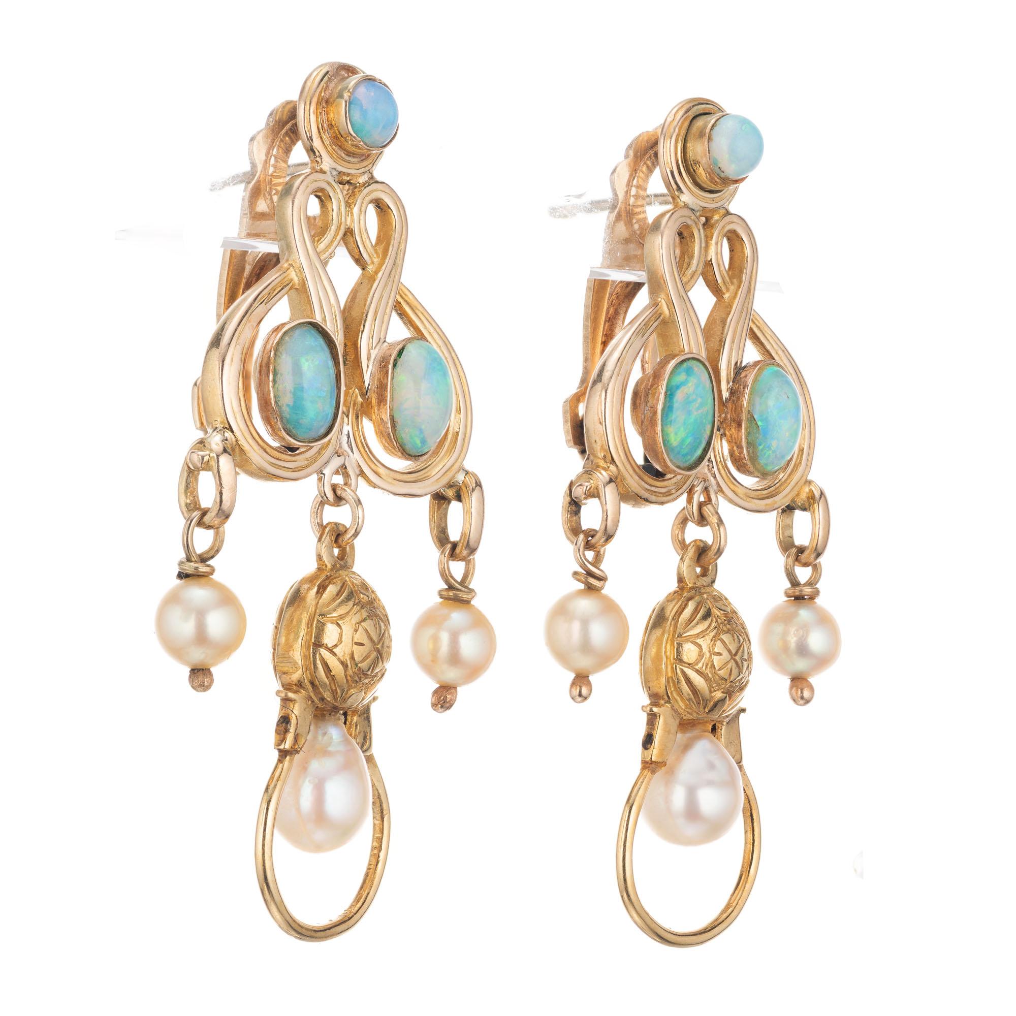 Clip post opal cultured pearl 14k yellow gold dangle chandelier earrings. Circa 1960's. Art Nouveau inspired design 

4 oval cabochon bluish green opals
2 round cabochon greenish blue opals
6 white/crème cultured pearls
18k Yellow Gold 
Tested: