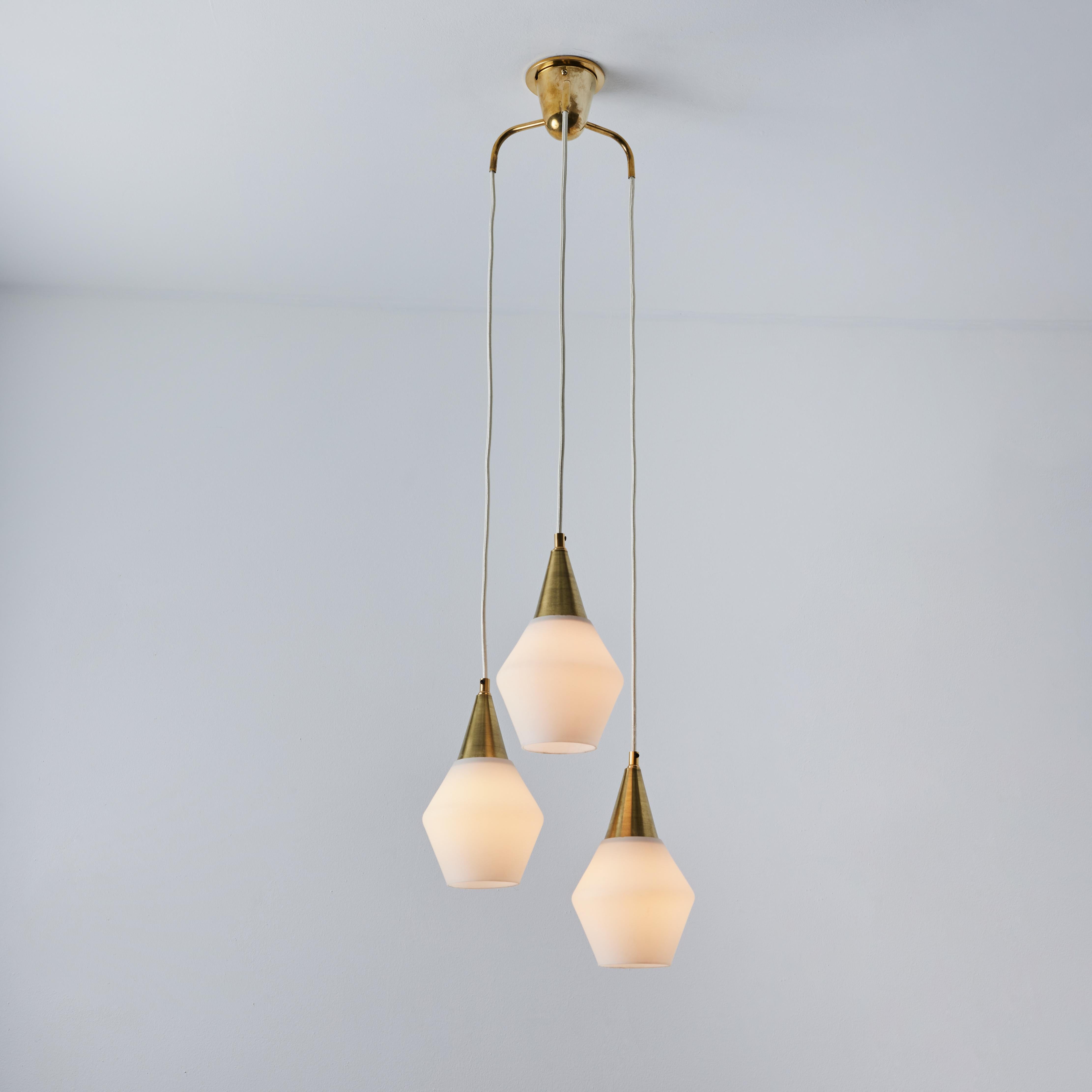 1960s Opaline Glass and Brass Chandelier Attributed to Mauri Almari for Idman. Executed in opaline glass and brass with white cloth cords. Highly reminiscent of Paavo Tynell's iconic designs for Taito Oy. An incredibly refined design that is