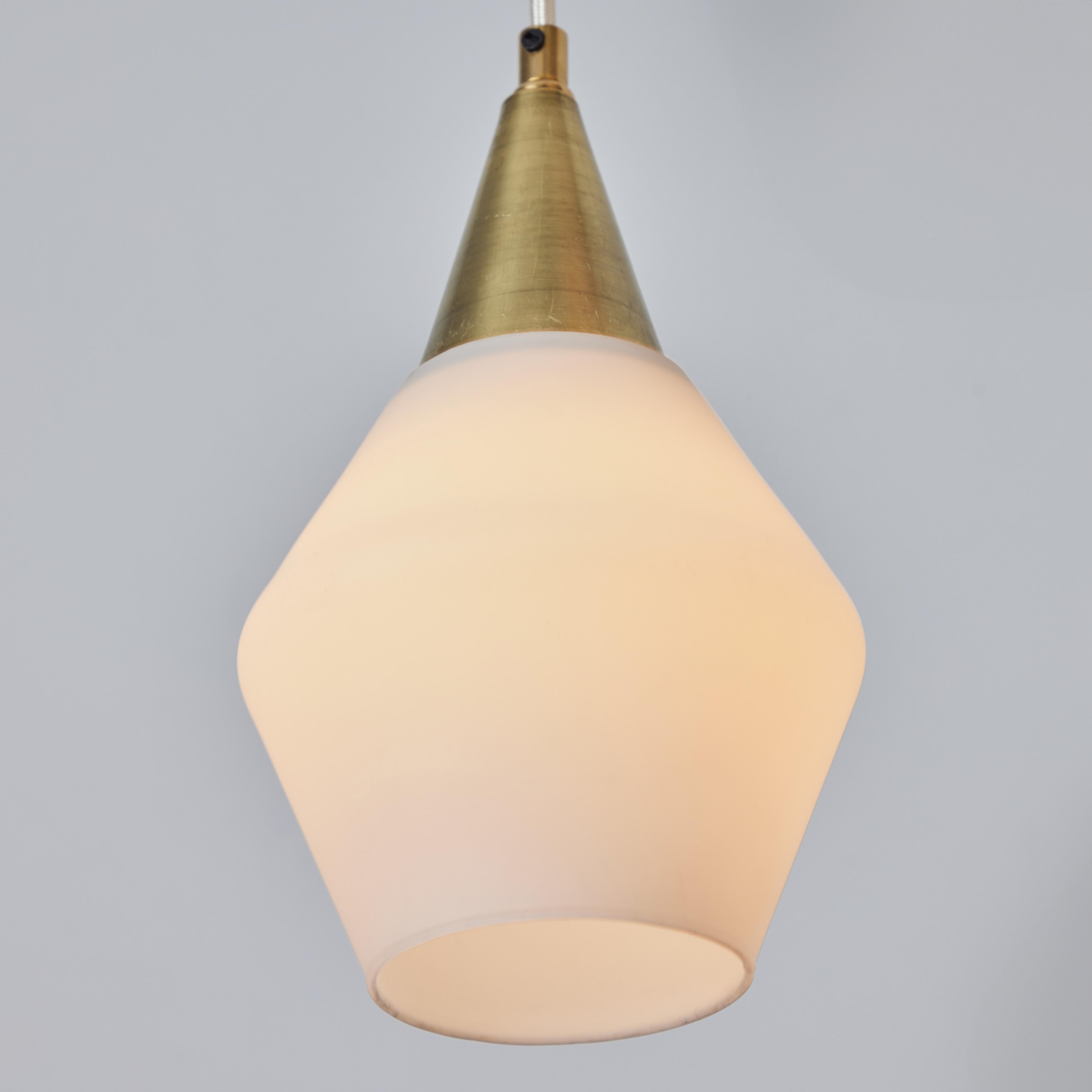1960s Opaline Glass and Brass Pendant Attributed to Mauri Almari for Idman. Executed in opaline glass and brass with white cloth cord. Highly reminiscent of Paavo Tynell's iconic designs for Taito Oy. An incredibly refined design that is