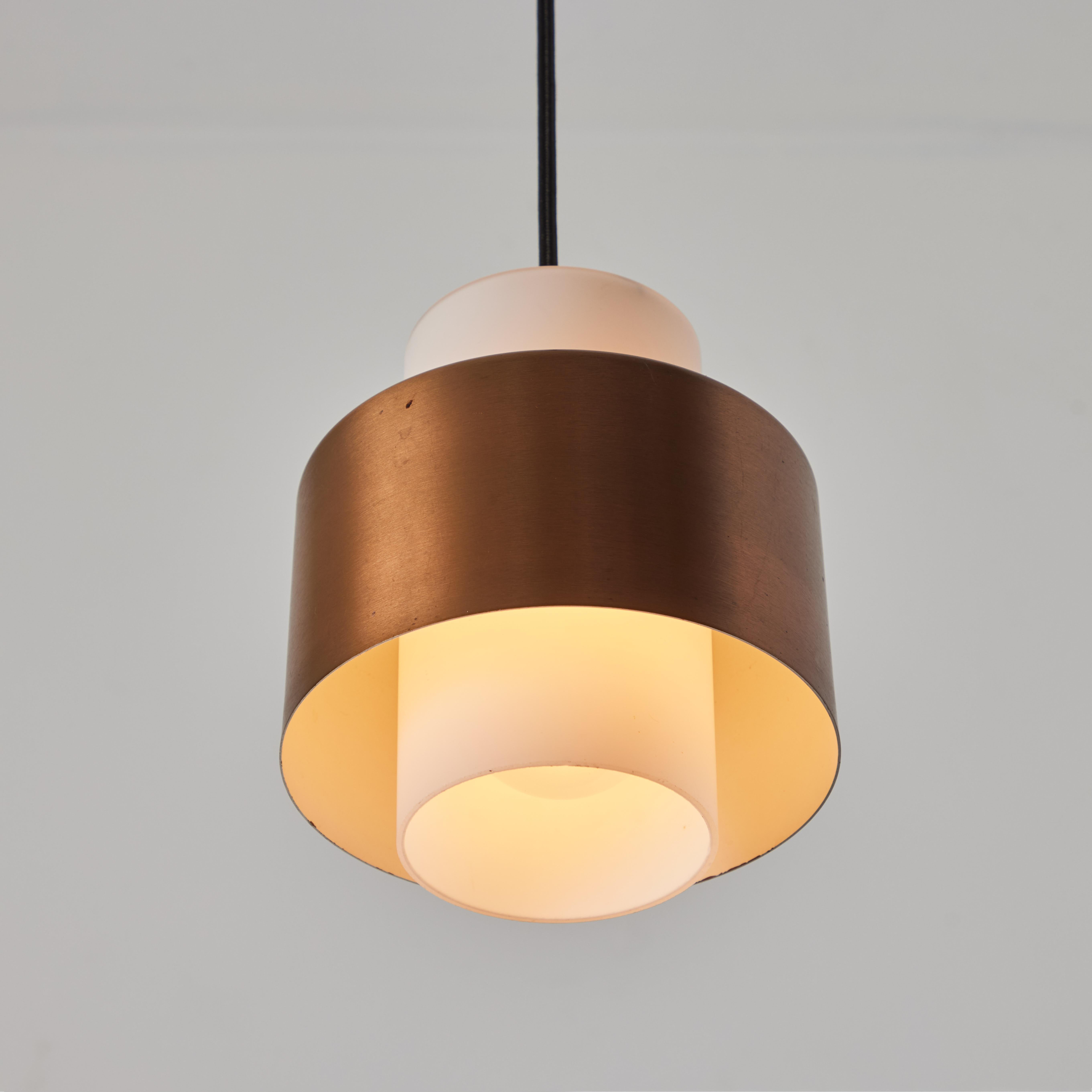 1960s Opaline Glass & Copper Pendant Lamp Attributed to Stilnovo.

A quintessentially 1950s Italian design executed in opaline glass with copper shade. A highly functional and sculptural suspension light of attractive scale and incomparable