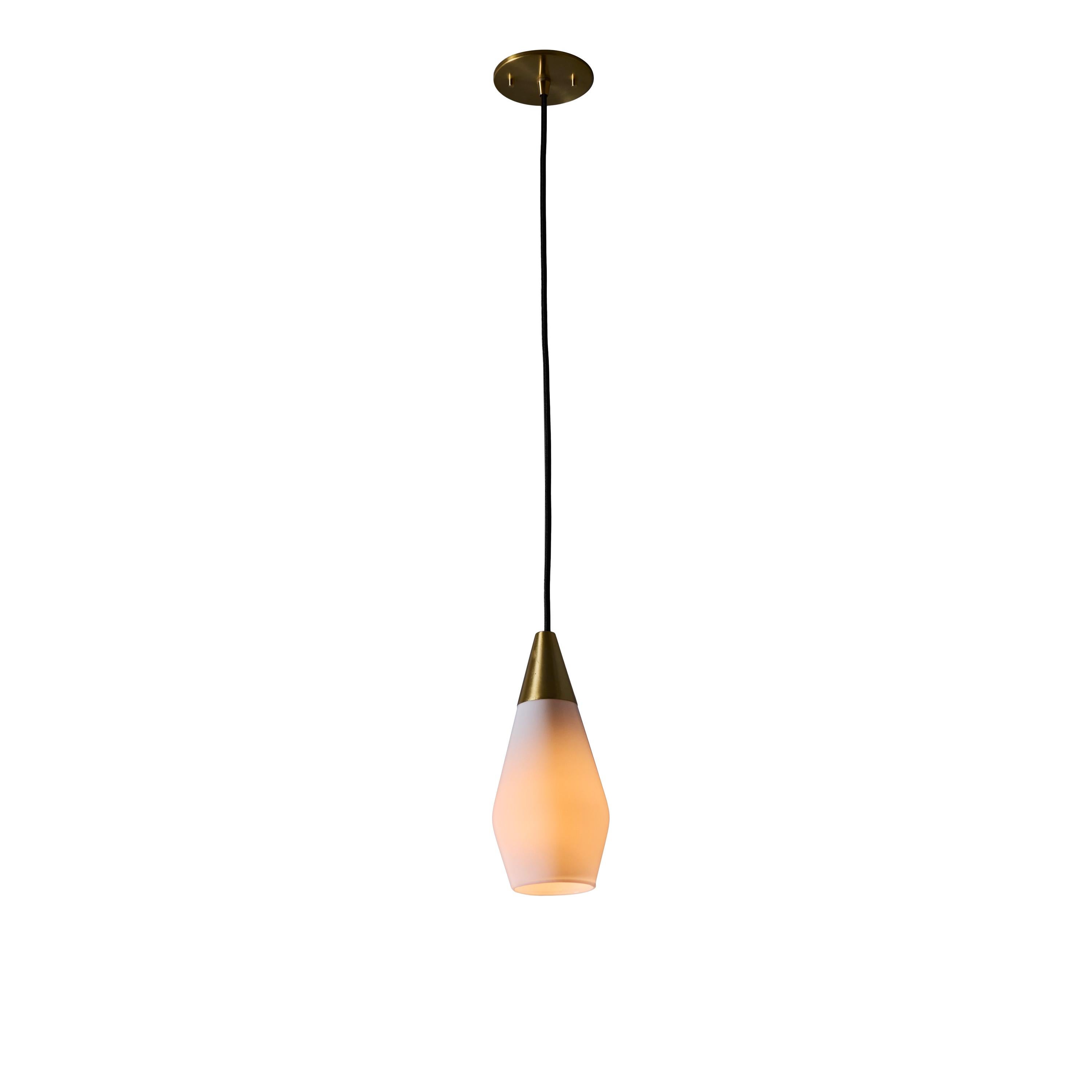 1960s Opaline glass geometric pendant lamp attributed to Mauri Almari. 

Executed in glossy opaline glass and brass with black cloth cord and custom fabricated period style brass canopy for mounting over a standard American j-box. Highly reminiscent