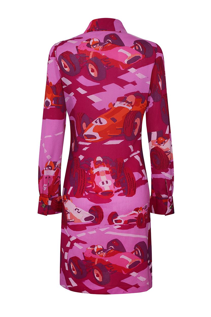 This desirable late 1960s early 1970s pink silk shirt dress with novelty racing car design is by British designer Ken Scott and is in immaculate vintage condition having retained all of its vibrancy of colour. The dress is long sleeved with 2.5