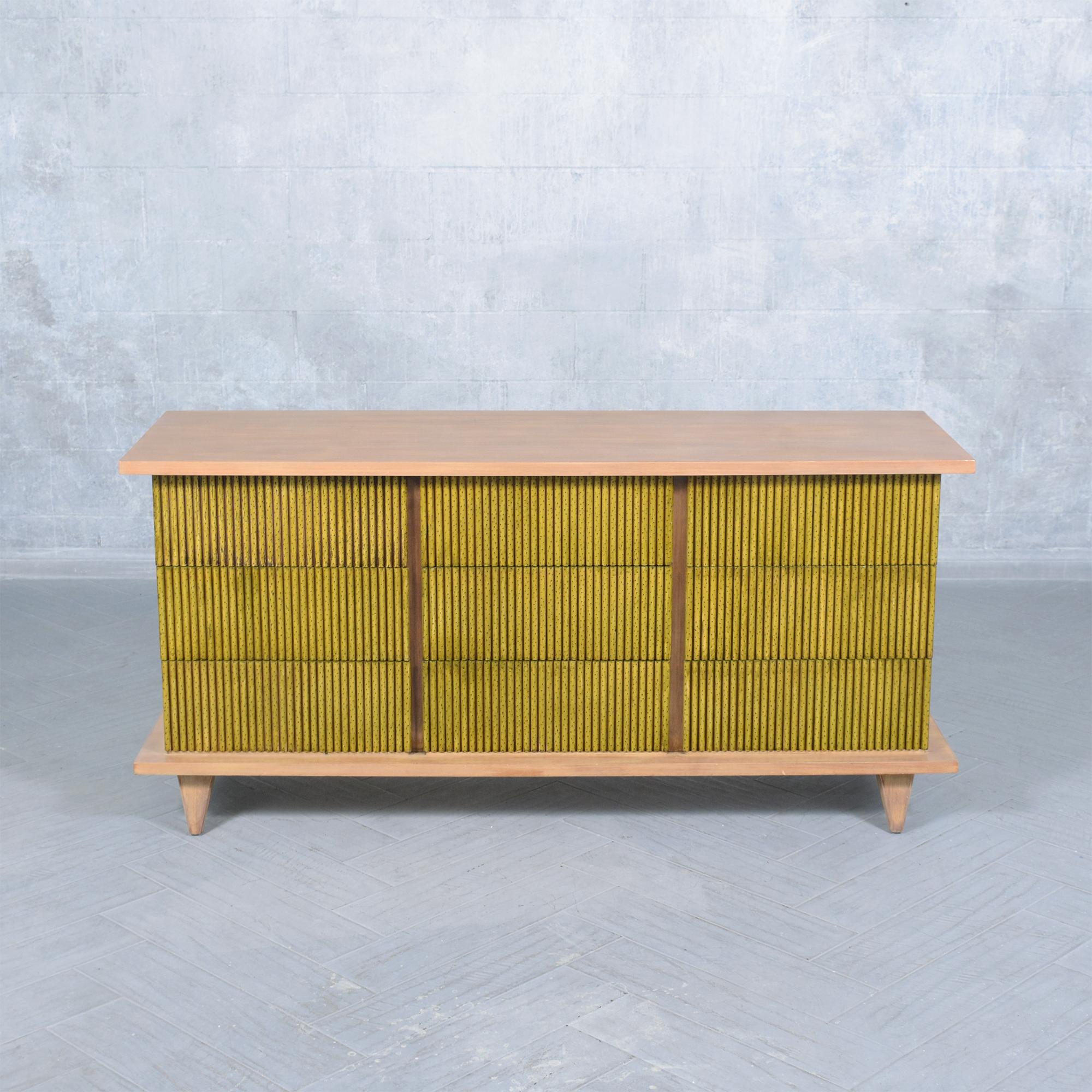 Experience the charm of our meticulously restored Mid-Century Organic Modern Chest of Drawers, crafted from premium walnut wood. This 1960s gem, rejuvenated by our expert artisans, is a testament to mid-century aesthetics. Its captivating mix of