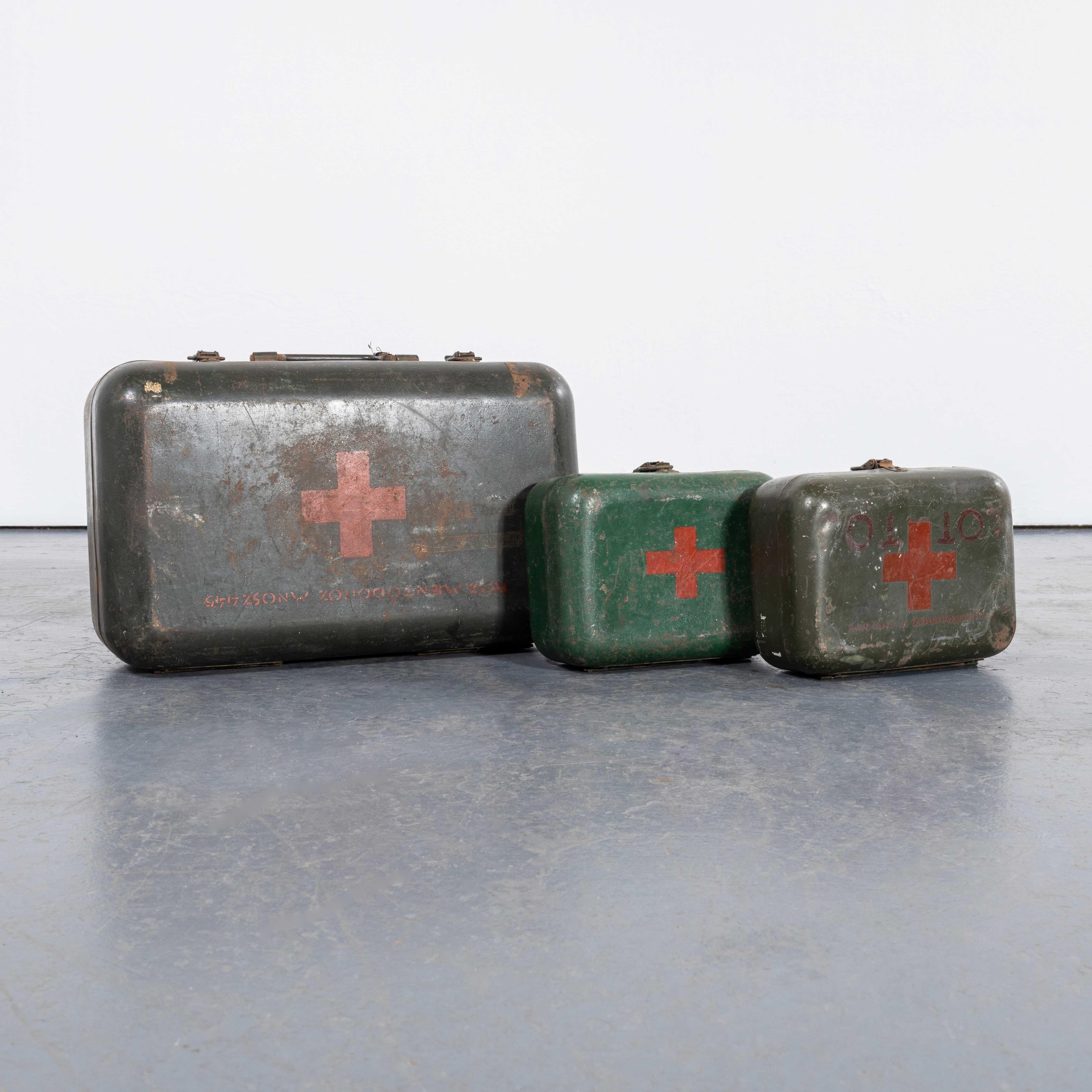 1960's Original Hungarian Army First Aid Boxes - Set Of Three Green. 
These were standard issue in the Hungarian army and we have a network of pickers that hunt them out for us. Occasionally some contain original first aid supplies not in useable