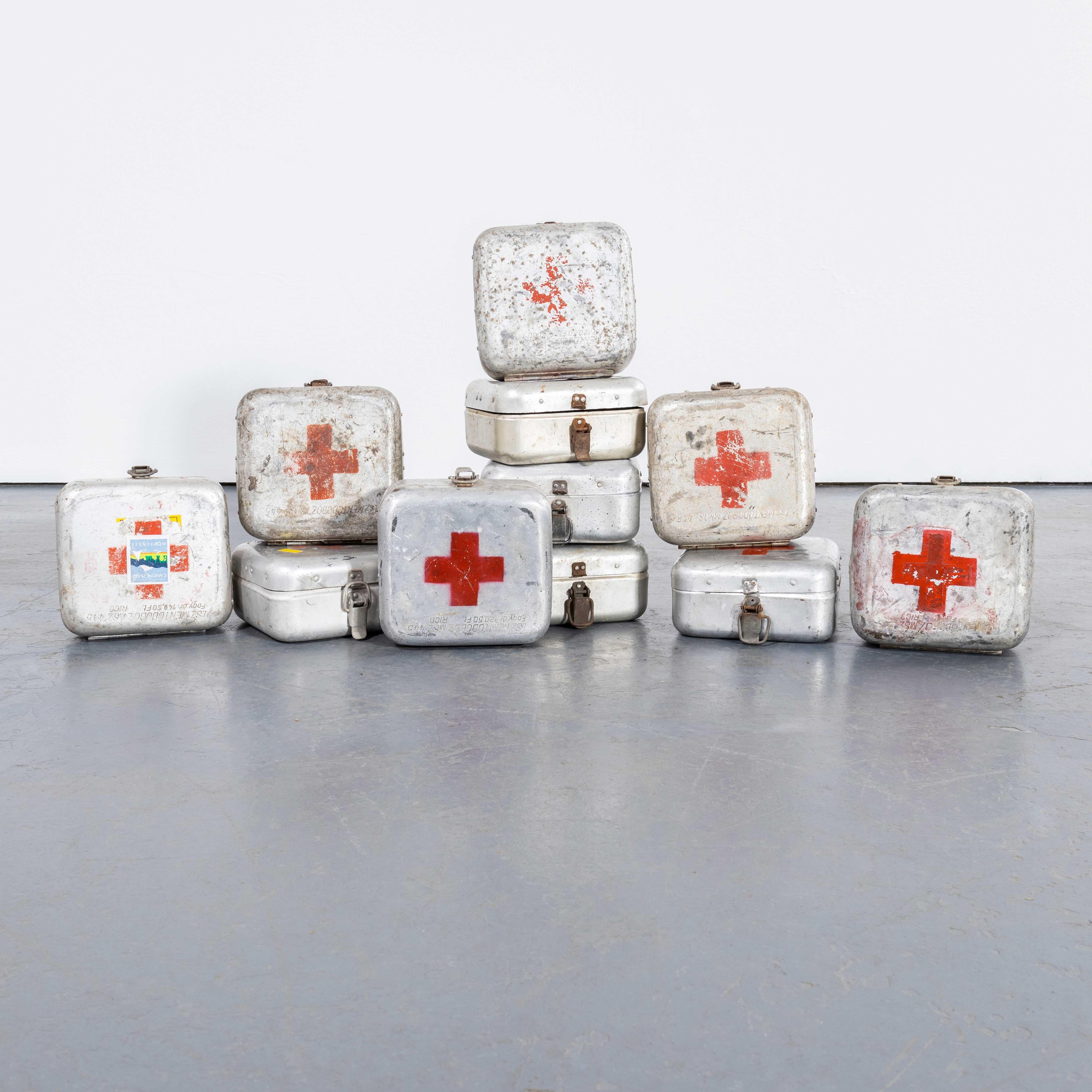 1960's Original Hungarian Army First Aid Boxes - Small Shape. 
These were standard issue in the Hungarian army and we have a network of pickers that hunt them out for us. Occasionally some contain original first aid supplies not in useable