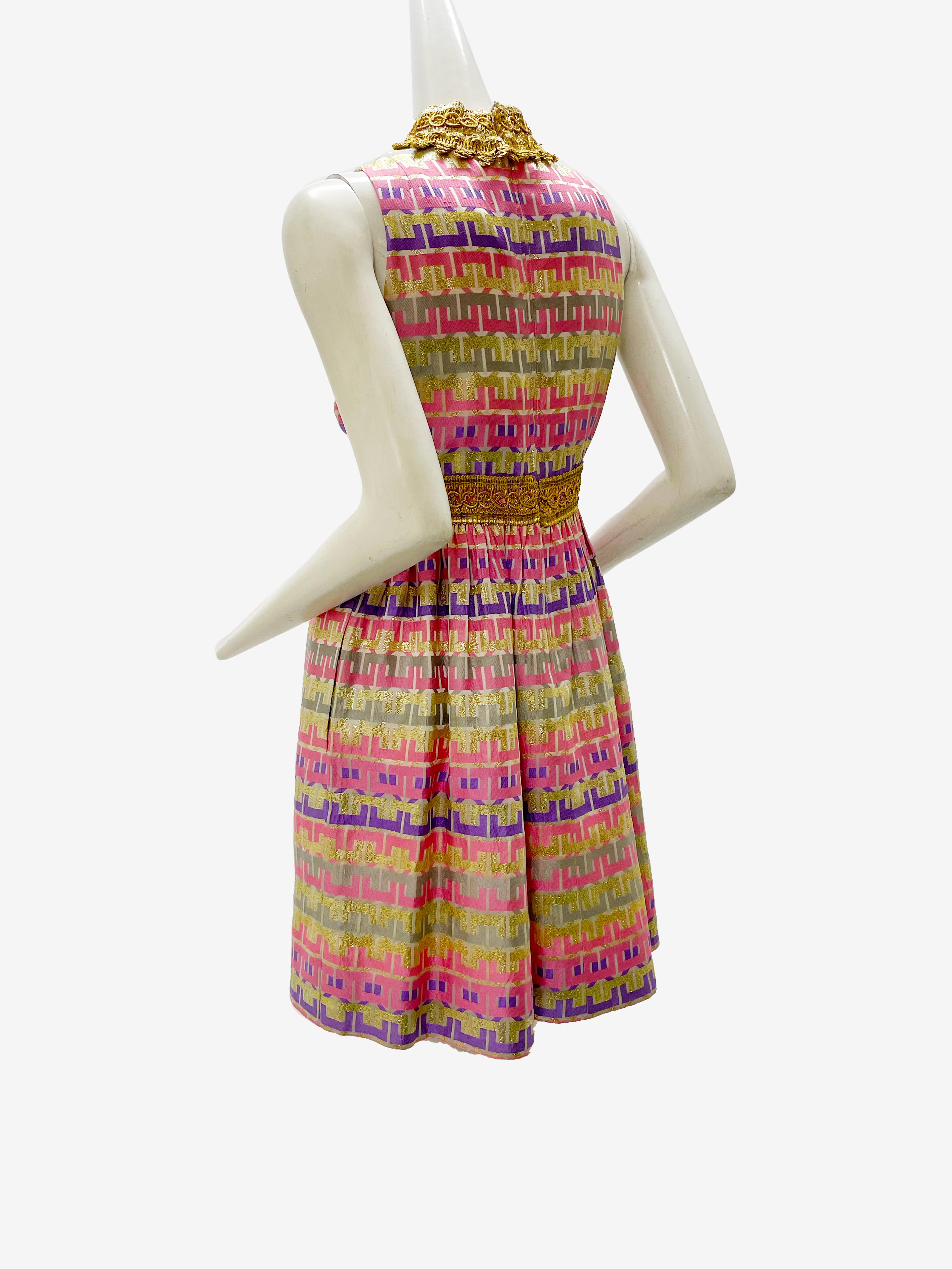 A beautiful 1960s Oscar de La Renta Mod striped brocade mini dress in pastel pinks, purples and gold. Heavy gold braidwork at neckline and Empire waist. New zipper. Fits a modern US size 4-6. See Measurement card for exact fit.