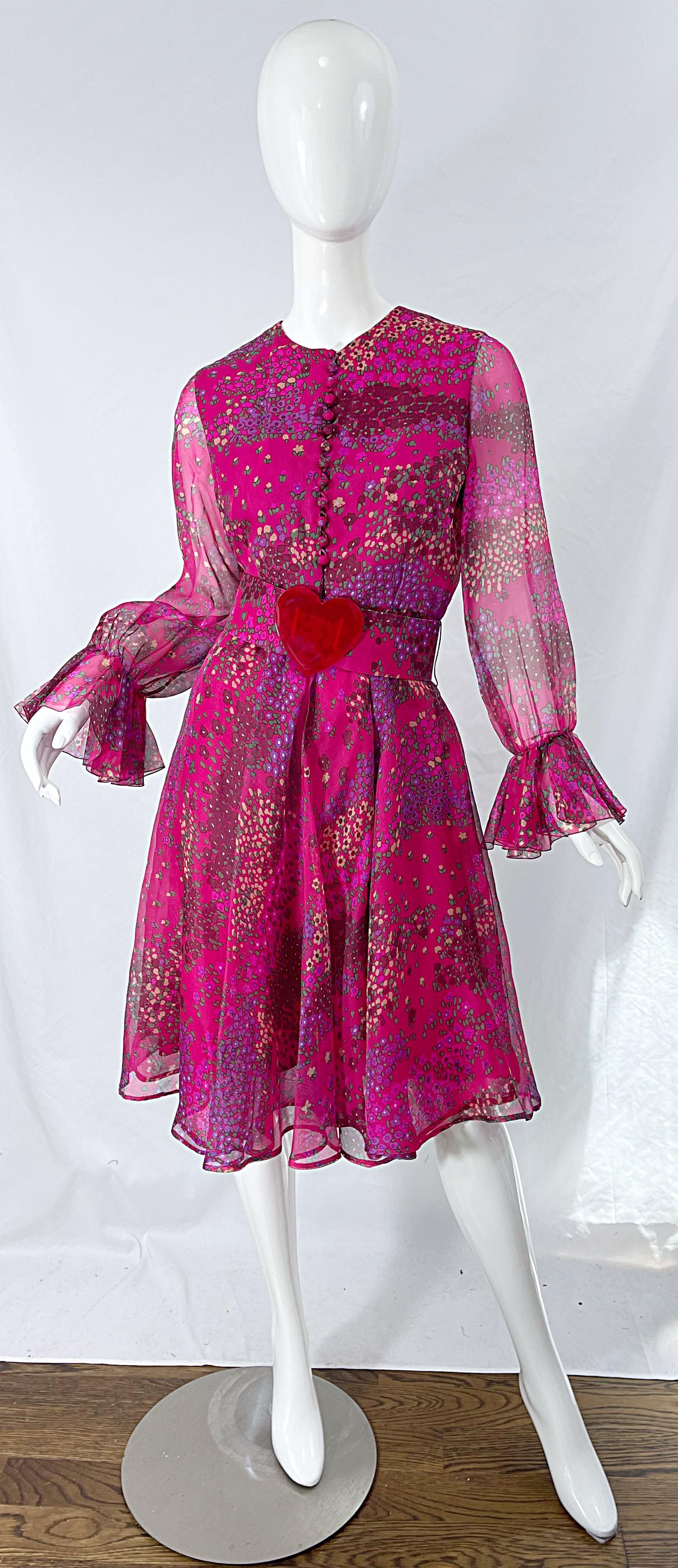 Perfect for Valentines Day! Chic 1960s OSCAR DE LA RENTA museum held pink flower and heart print long sleeve silk dress ! Features vibrant colors of purple, burgundy, green, red and pink throughout. Original detachable belt with a large red heart