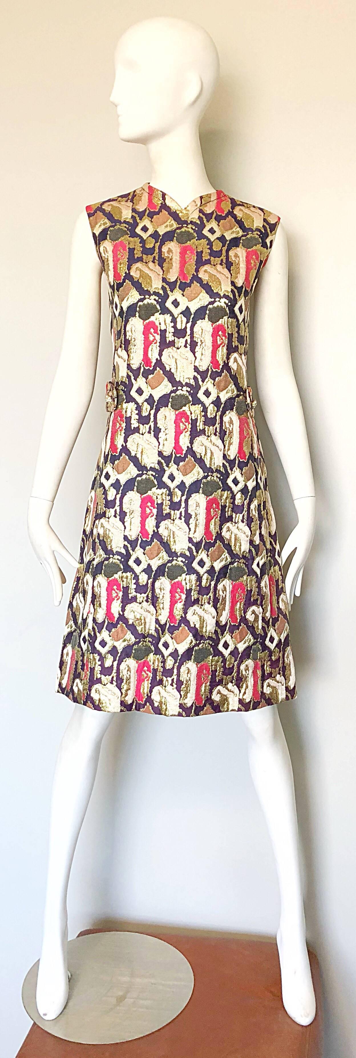 Fabulous 1960s OSCAR DE LA RENTA silk brocade A Line dress and coat ensemble! Features lovely abstract prints in gold, purple and pink. Jacket features a sharp tailored bodice with a slightly flared body. Pockets at each side of the hips. Double