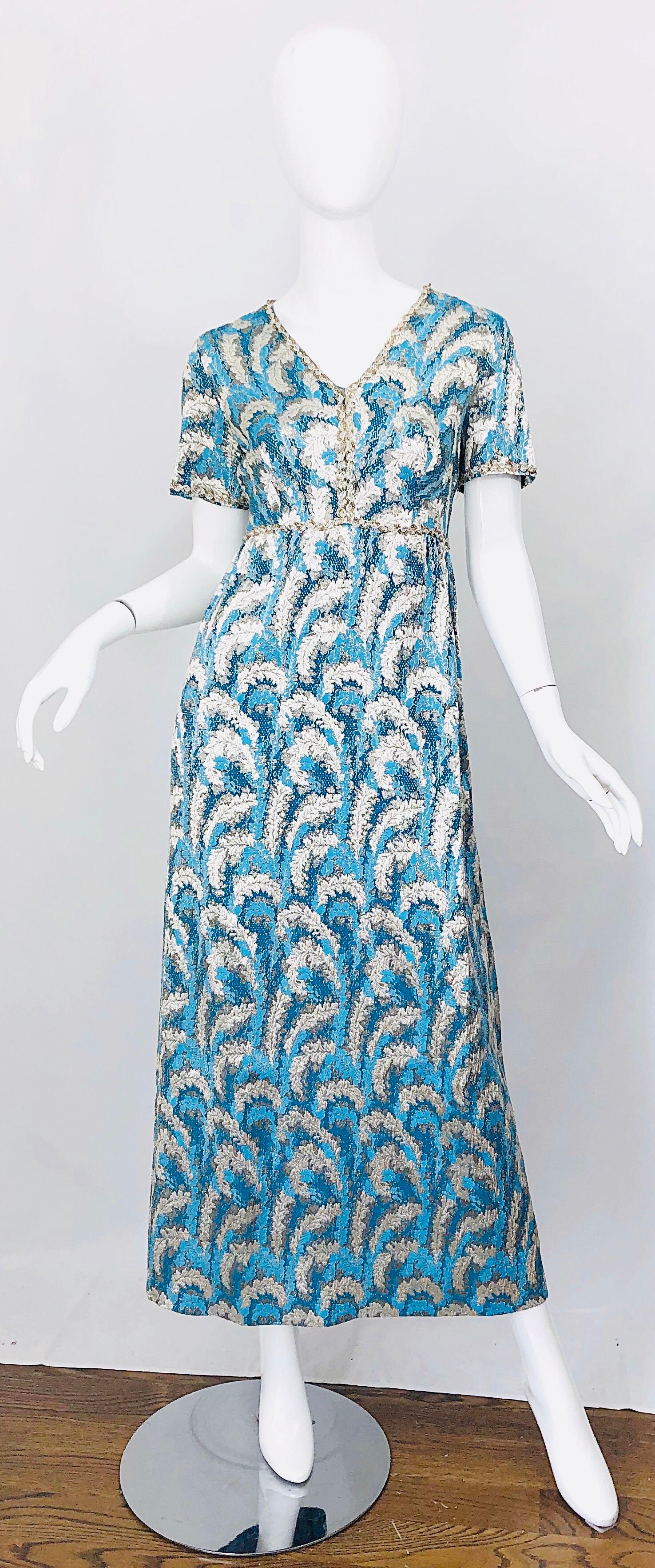 Beautiful late 1960s Oscar de la Renta turquoise blue and silver silk brocade sequined short sleeve evening gown / maxi dress! Feather prints throughout. Features a tailored bodice with a forgiving skirt. Silver sequins around the collar and