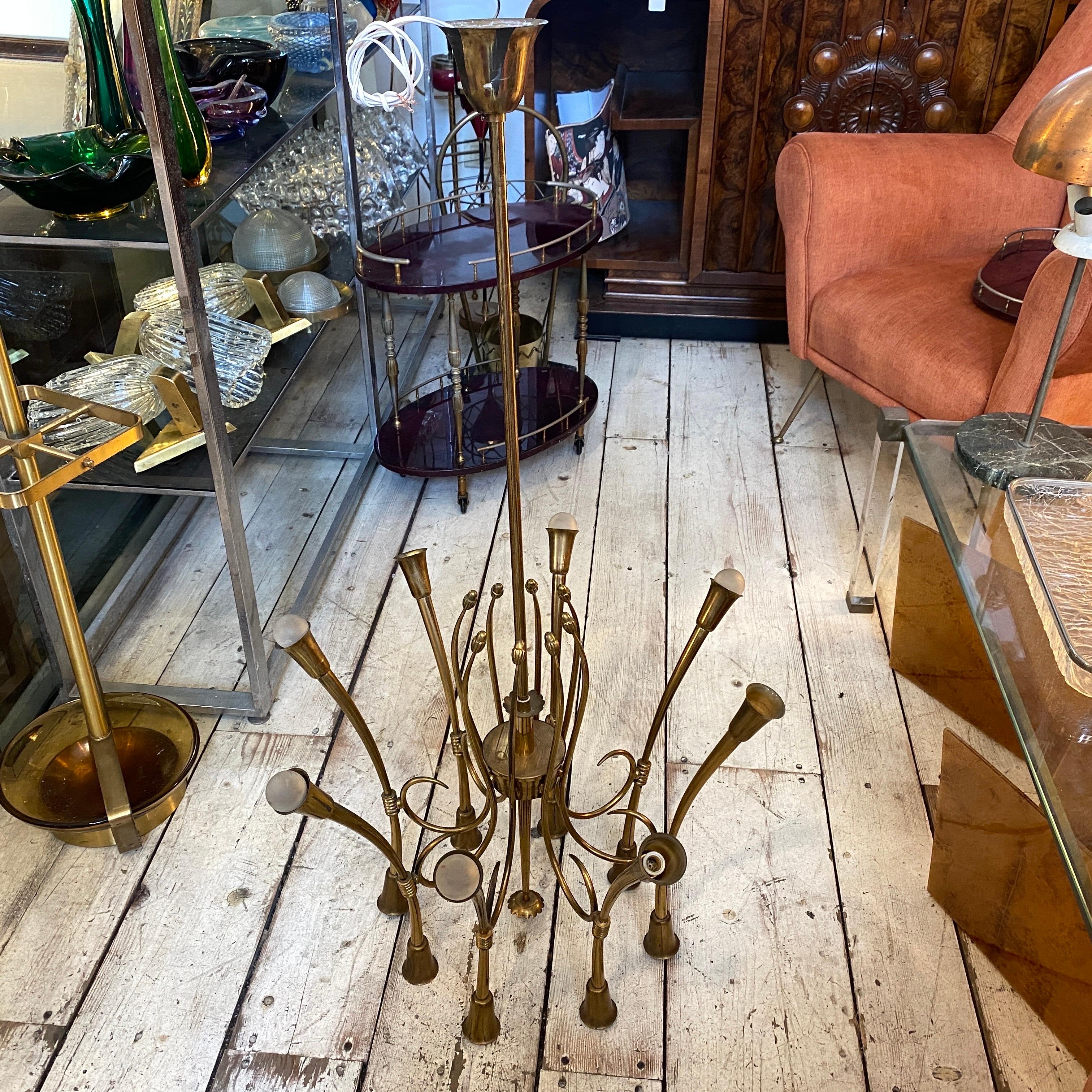 A solid brass 16 lights brass chandelier designed by Oscar Torlasco and manufactured in Italy in the Sixties. Brass it's in original patina, electrical part have been checked by a professional. It works both 110-240 volts and needs 16 regular e14