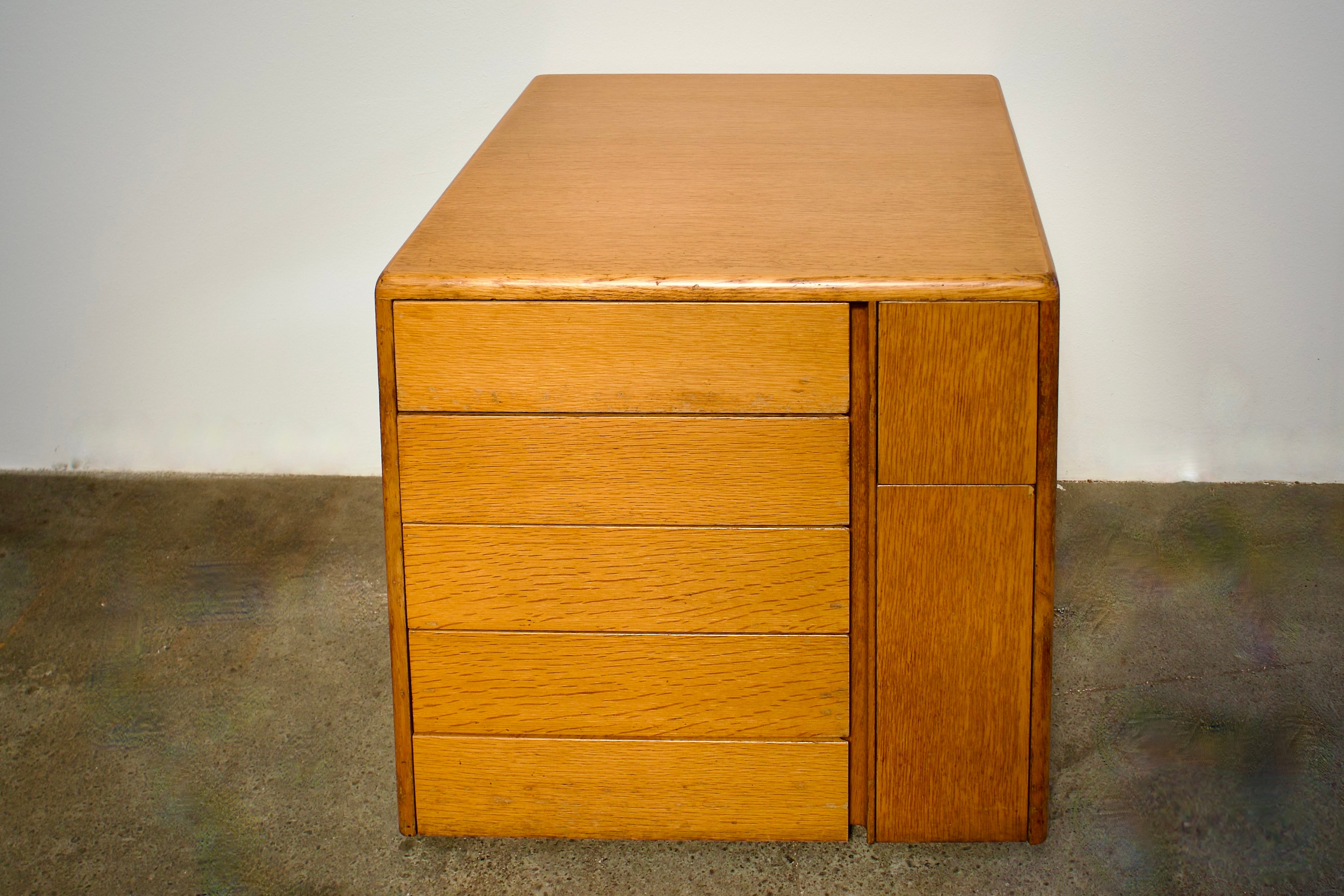 Stunning Osvaldo Borsani for Tecno Mid Century Modern low chest of drawers with integrated waste paper. Doubles as an attractive side table or sideboard. Clean lines, functional and beautiful. While it is made of solid wood and weighs 80 lbs (35kg)