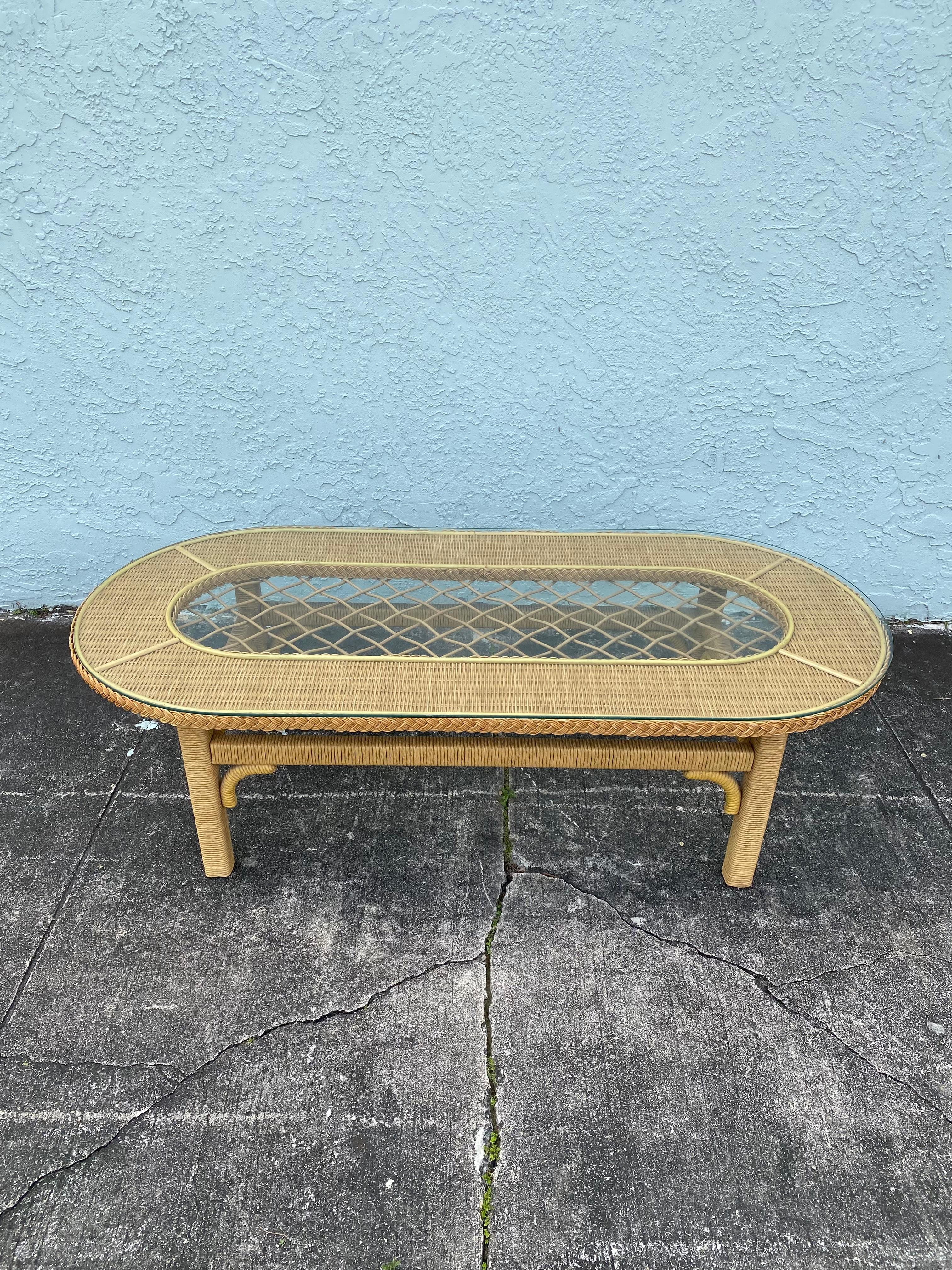 On offer on this occasion is one of the most stunning and rare oval rattan coffee table you could hope to find. Outstanding design is exhibited throughout. The beautiful table is statement piece and packed with personality!  Just look at the