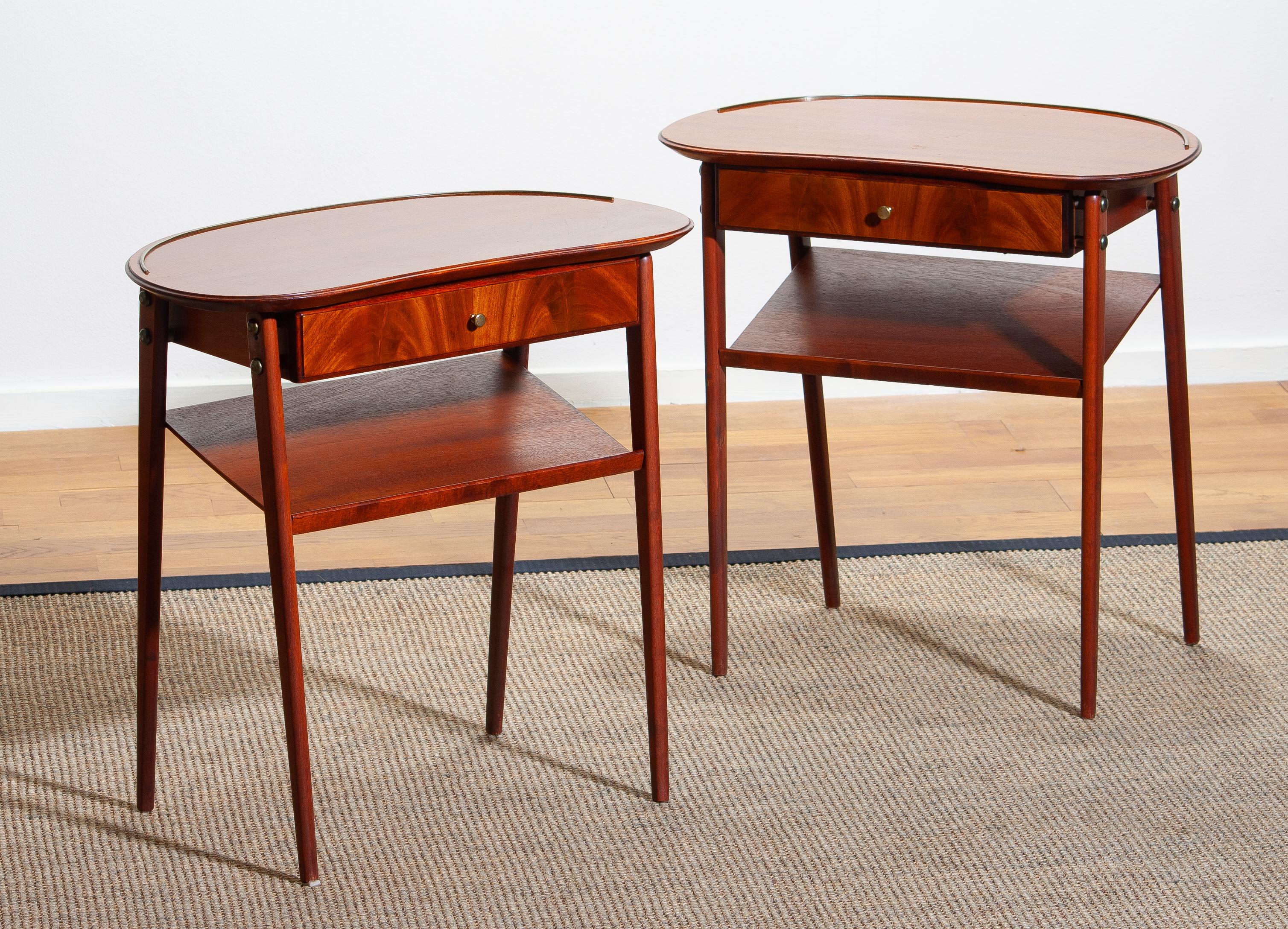Beautiful and elegant set of two brass and mahogany nightstands made in Sweden. 1960s.
The set is in good condition.