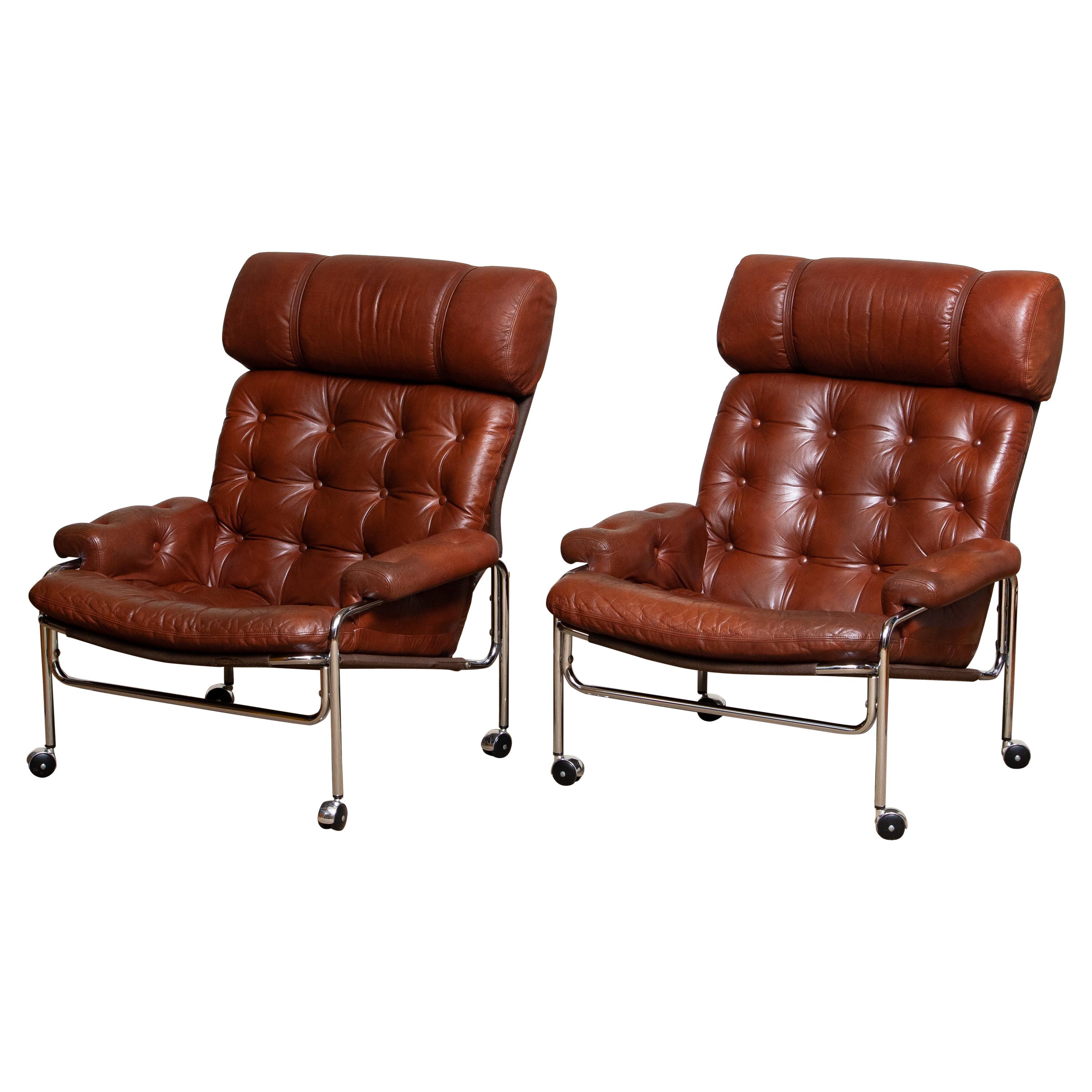 1960s Pair Easy / Armchairs in Chrome and Aged Brown /Cognac Leather by Lindlöfs