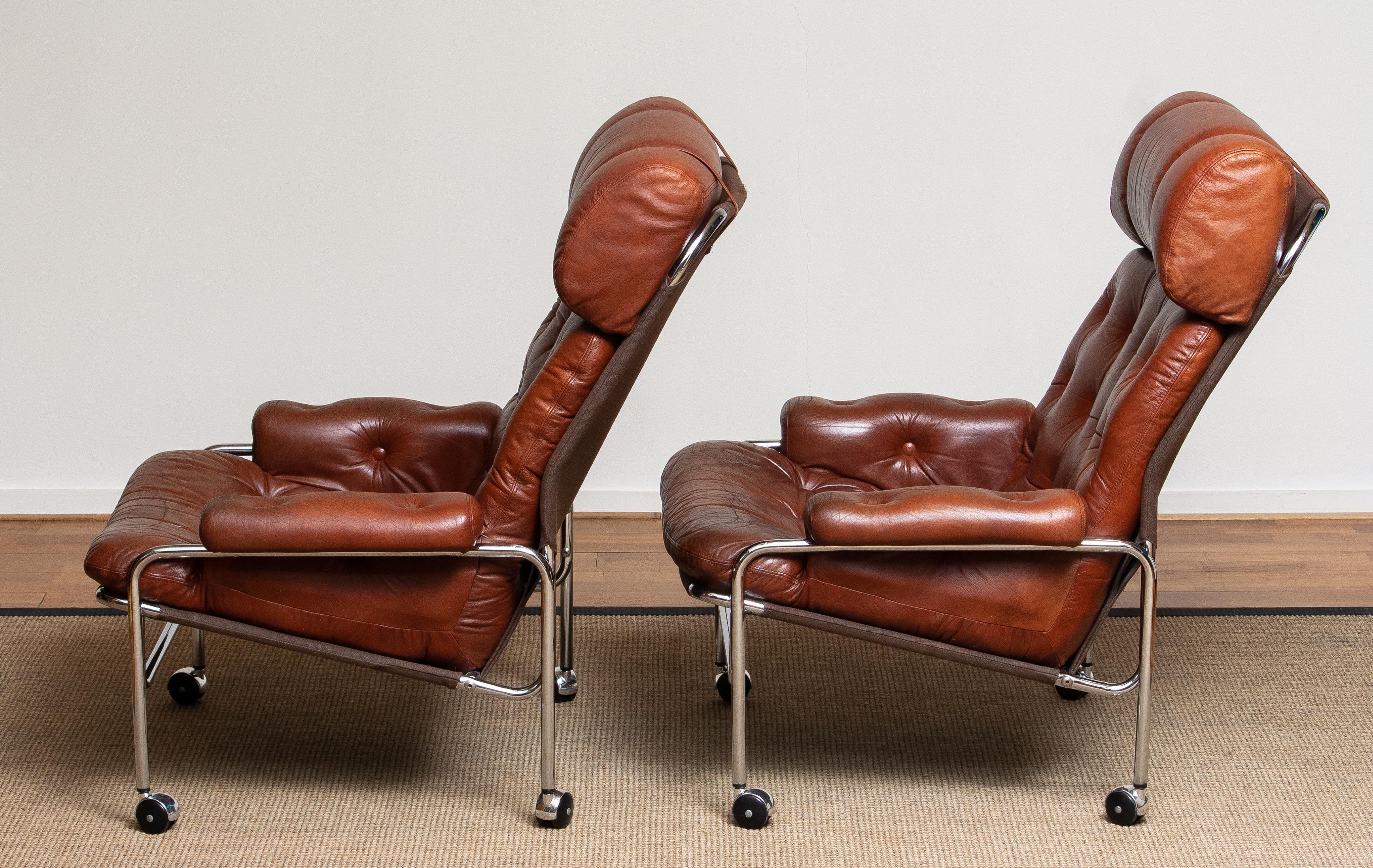 Mid-20th Century 1960s Pair Easy / Armhairs in Chrome and Aged Brown / Cognac Leather by Lindlöfs
