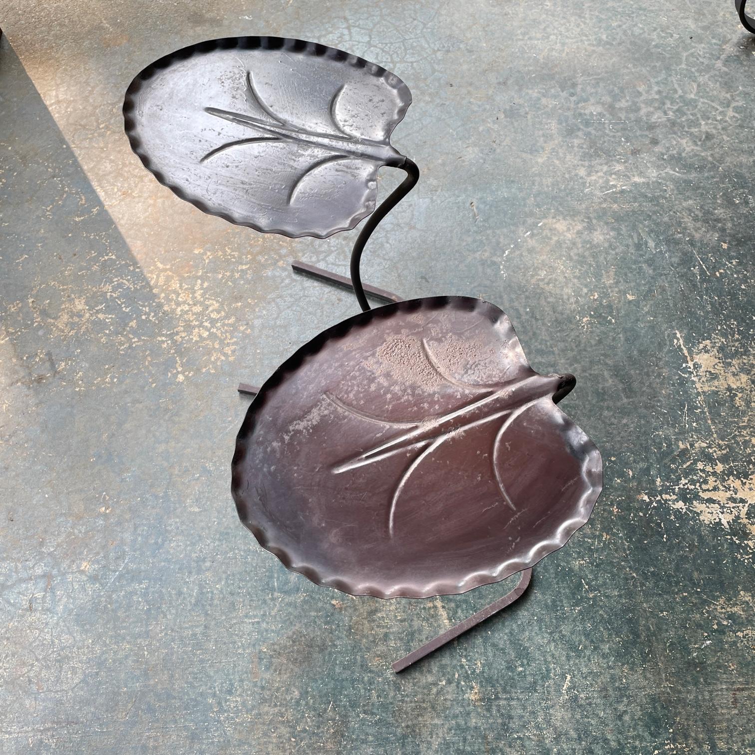 Pair of black outdoor metal furniture side tables. These are made in the 1960s, made by John Salterini. Sold in original finish with tops just cleaned and buffed. So still showing heavy oxidation and exposure wear.