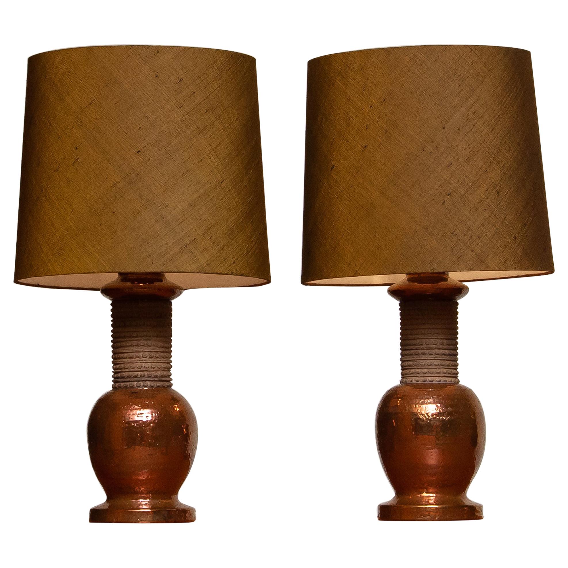 Beautiful set of two large, with copper covered, ceramic table lamps made by Bitossi Italy in the 1960s for Bergboms Sweden.
Both lamps are in excellent condition and technically 100%. The fitting are for a screw bulb size E27 E28 and suit 110 and