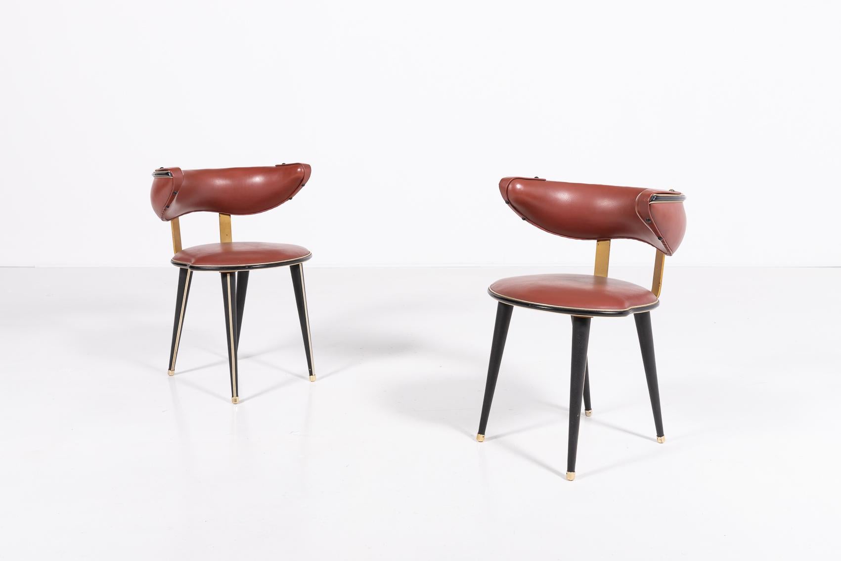 Beautiful curved backrest pair of chairs from Anonima Castelli, 1960’s. Wooden frame with burgundy Eco Leather seat and backrest upholstery.

Condition
Good, age related wear and marks

Dimensions
depth: 75 cm
width: 80 cm
height: 74 cm
seat height:
