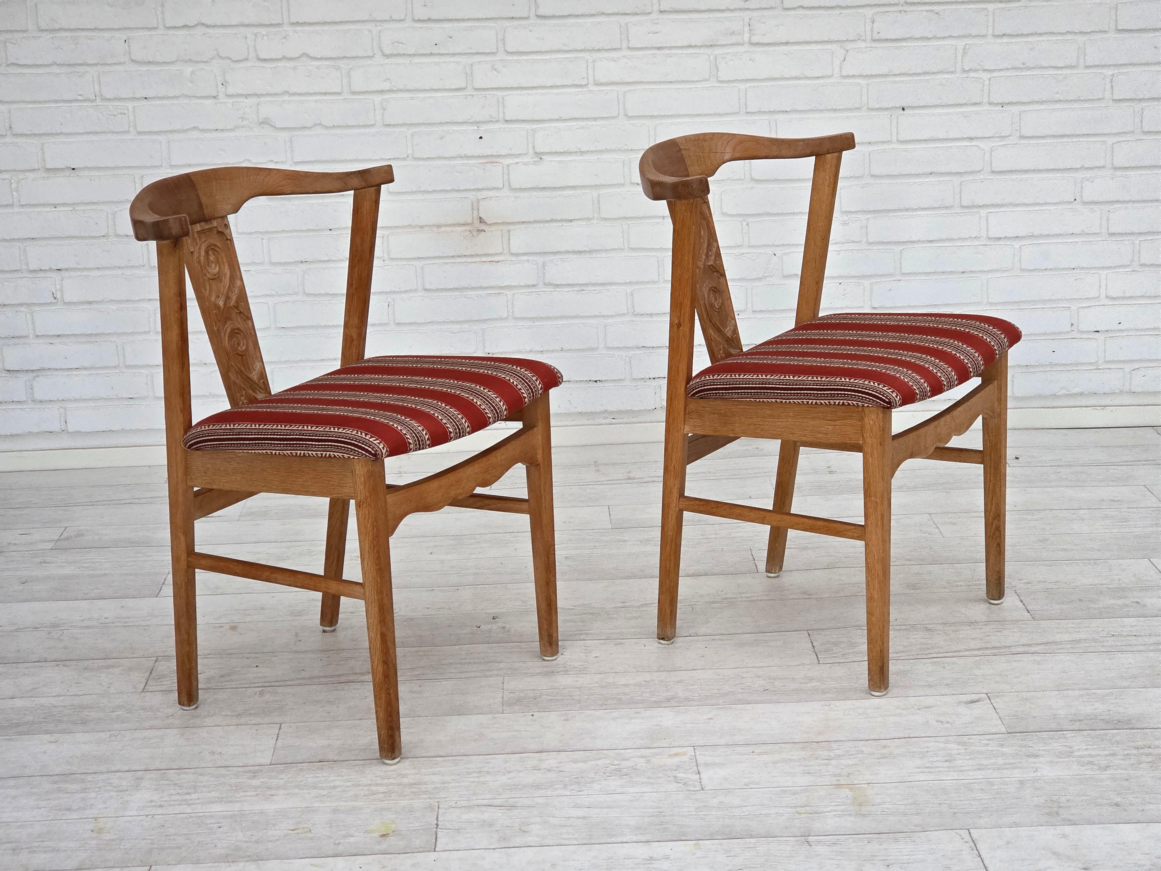 1960s, pair of Danish dining chairs. Solid oak wood, furniture wool. Original very good condition: no smells, no stains and stable construction. Manufactured by Danish furniture maker in about 1965-70s. Original Scandinavian vintage design directly