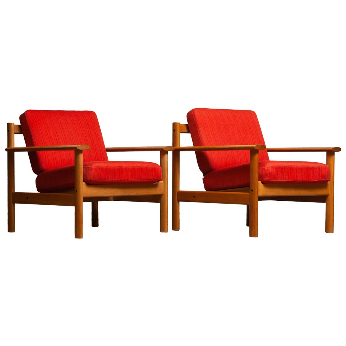 Firm set of two Danish oak lounge easy chairs in the manner of Poul Volther from the 1960s.
The cushions are a metal base with spring and still upholstered with the original fabric.
Overall condition is good.
  