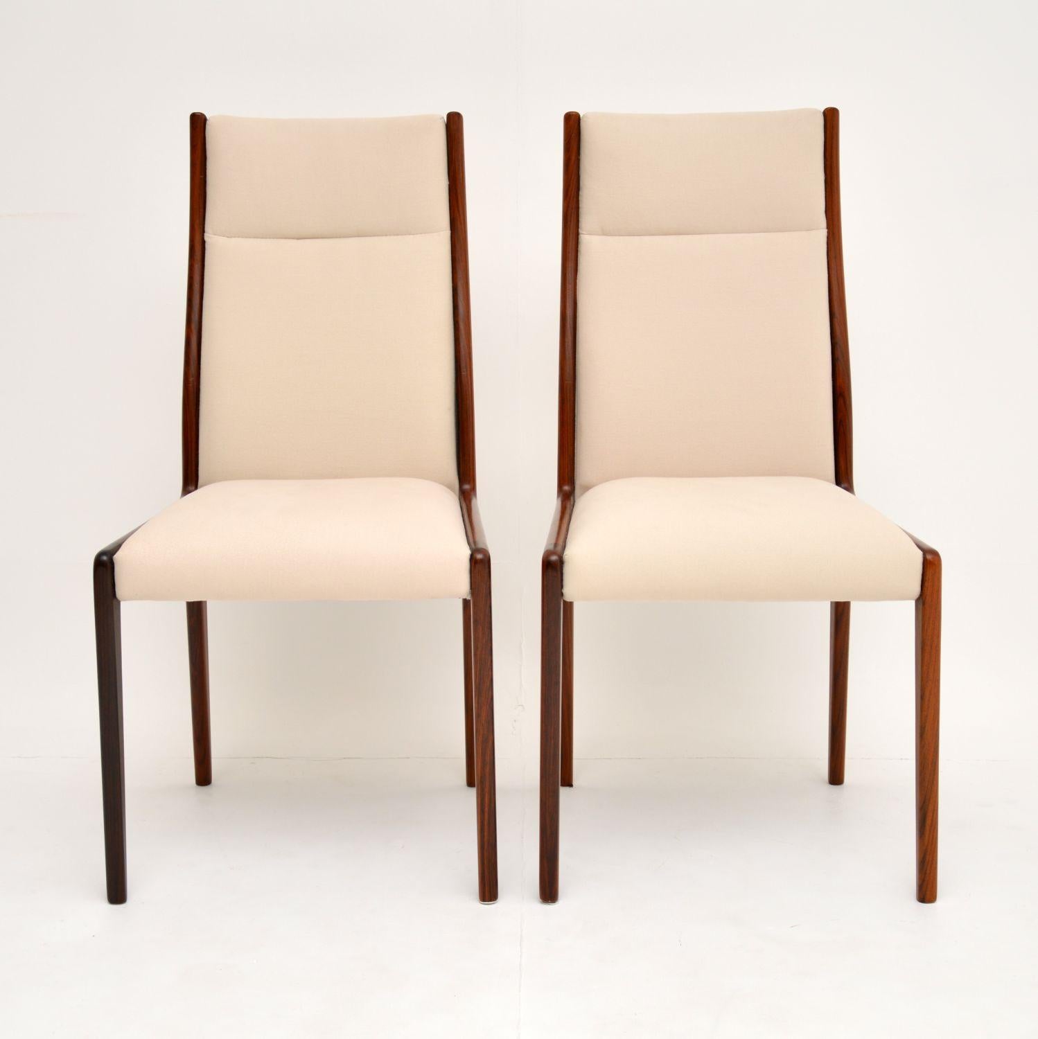 A beautifully designed pair of vintage Danish chairs in solid wood. These date from the 1960s, they are super quality.

We have had these fully restored, the frames have been stripped and re-polished to a very high standard. The colour and grain