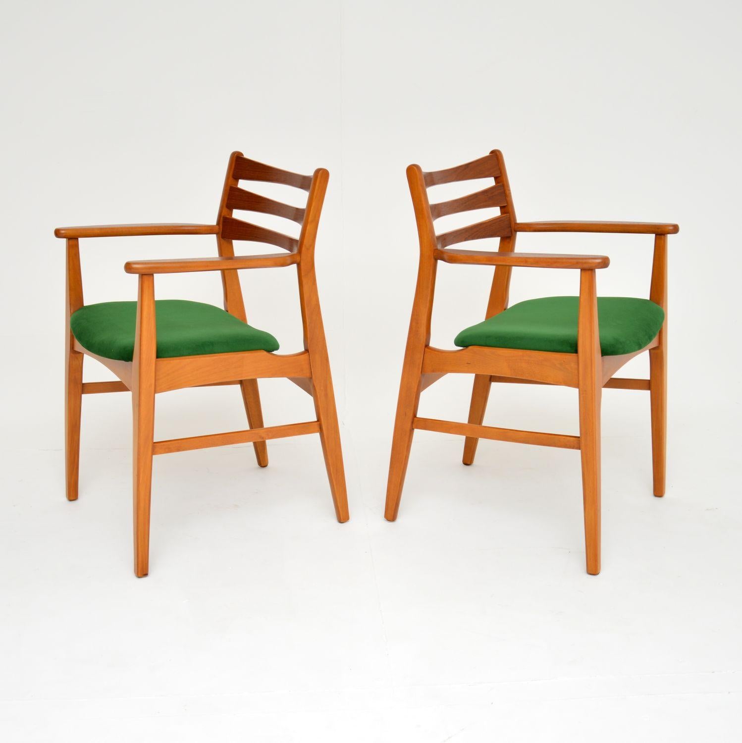 An excellent pair of Danish vintage carver armchairs. These were made in Denmark and date from the 1960’s.

They have solid beech and teak frames, they are beautifully designed and extremely well made.

We have had these restored to perfection,