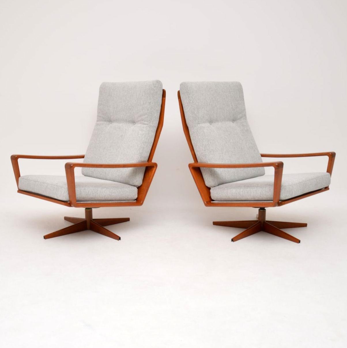 A stylish and extremely comfortable pair of vintage Danish swivel armchairs in teak, these were designed by Arne Wahl Iversen for Komfort, they date from the 1960's. We have had the frames stripped and re-polished to a very high standard, the light