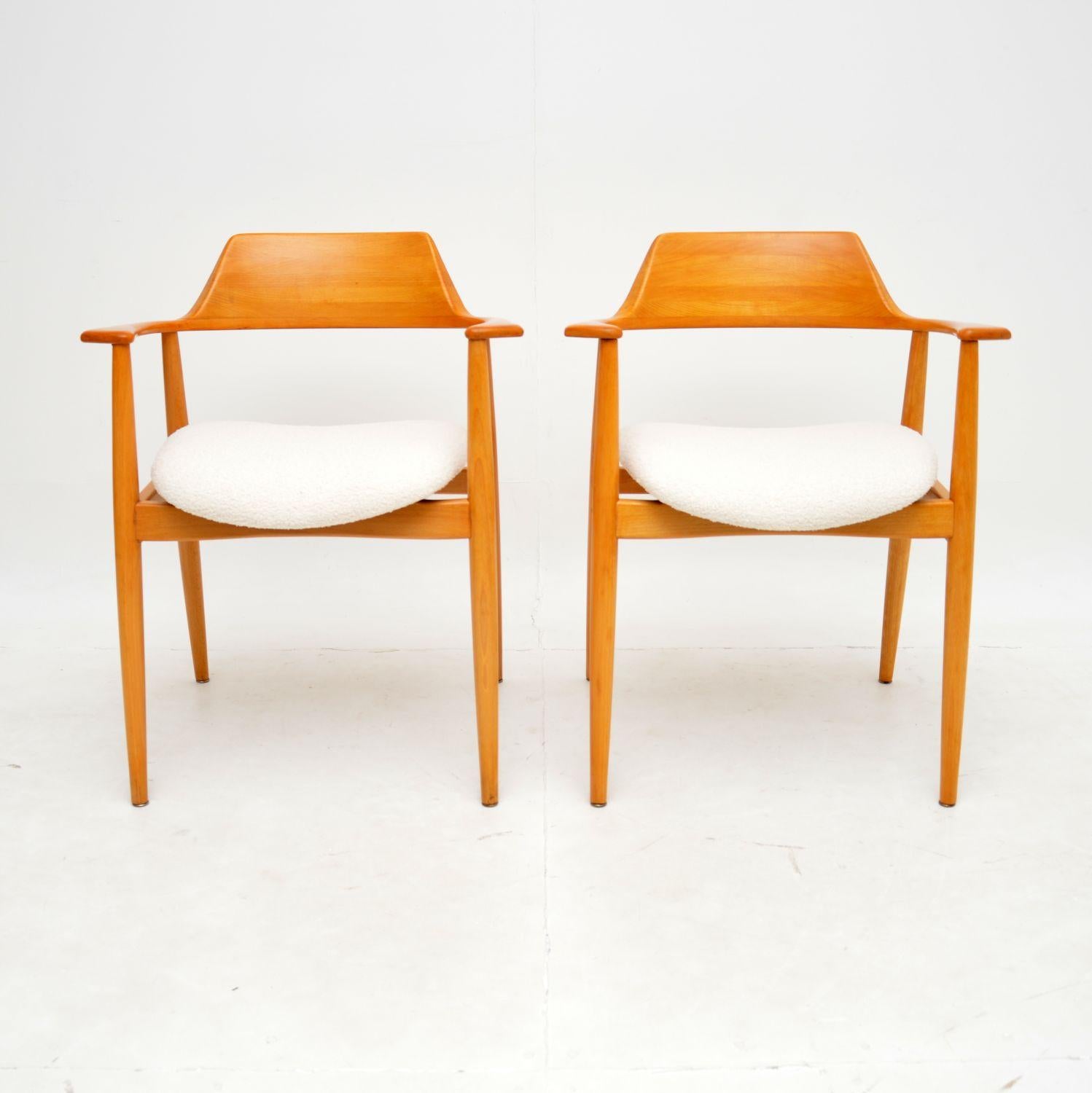 An extremely stylish and well made pair of carver armchairs. They were made in Denmark, and date from the 1960’s.

They are of amazing quality and are made from solid cherry wood. They have beautifully curved back and armrests, they sit on finely