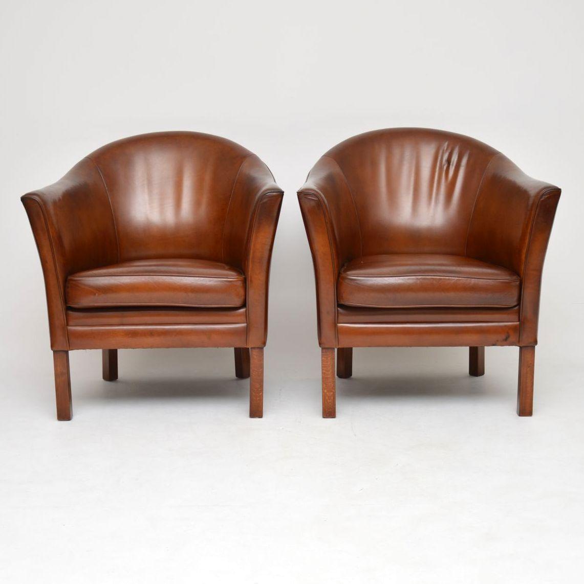 A stunning pair of vintage Danish armchairs, these were made by Mogens Hansen and they date from the 1960s. They are in great condition for their age, the leather has been hand coloured and revived by our professional leather polisher, they have a
