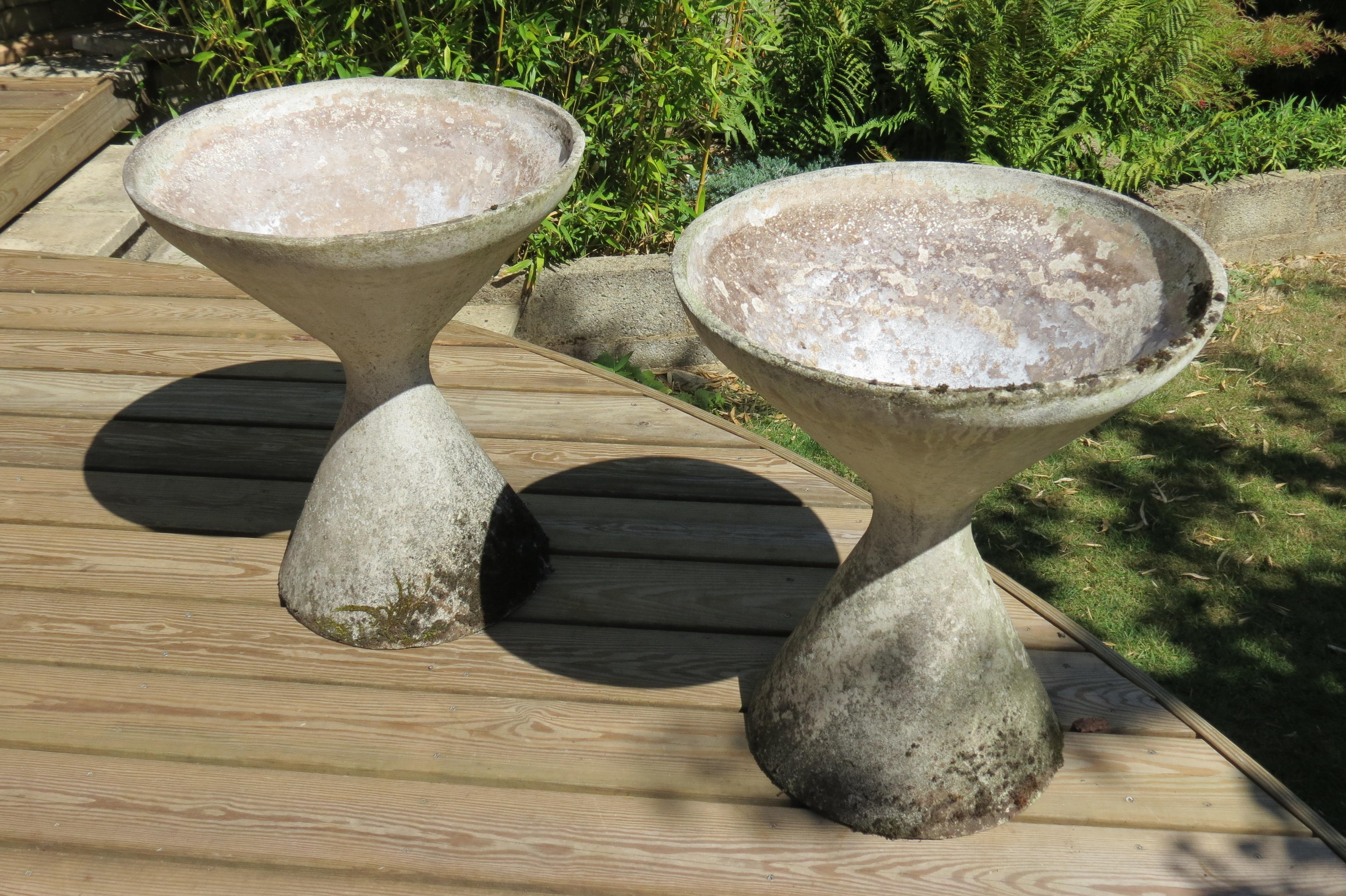 Pair of planters from the 1960s by Florastone.

Made from concrete.  In good condition, wonderfully patinated.

Stamped Florastone No 894.
