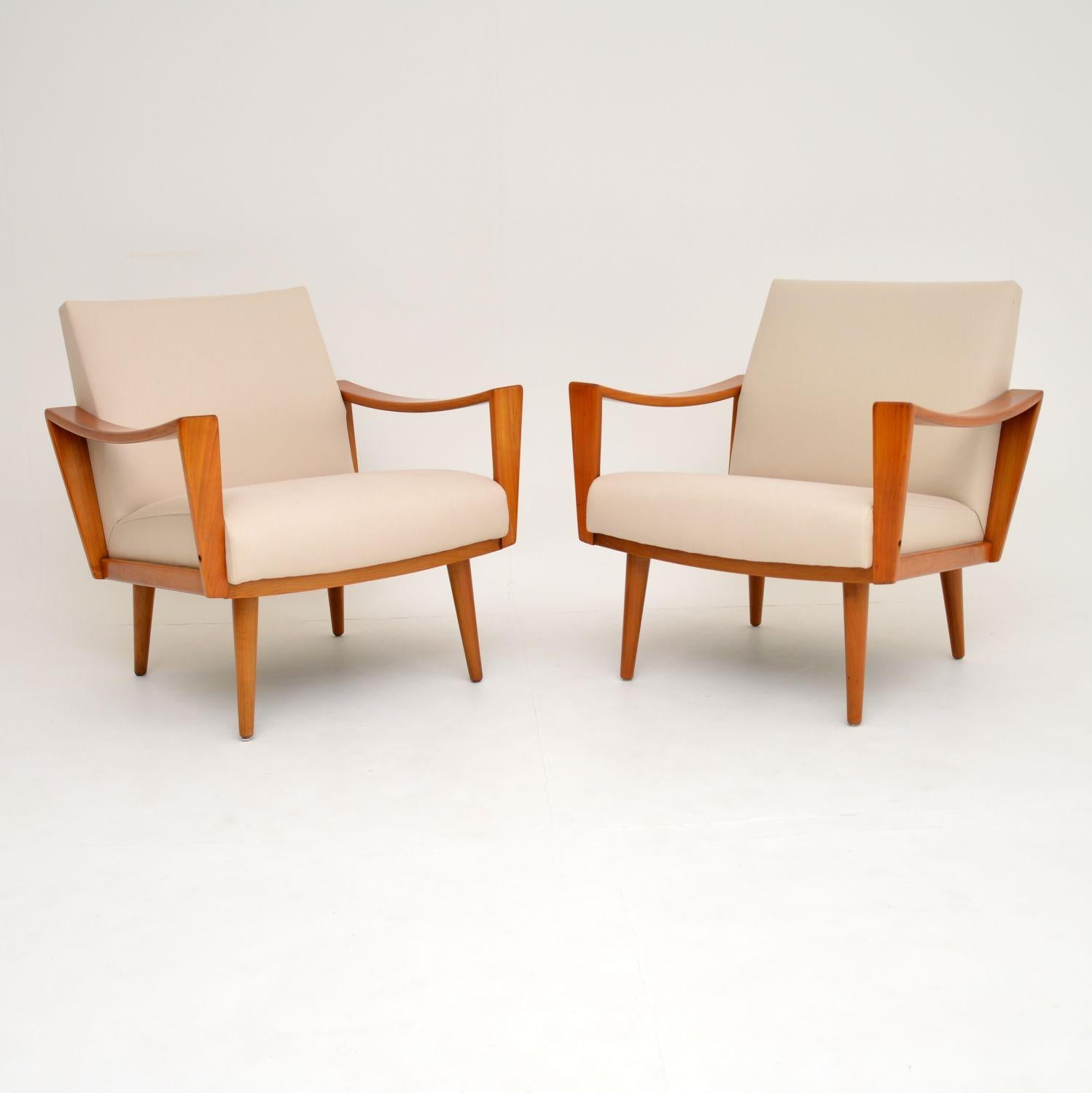 A stunning and comfortable pair of vintage armchairs, made in the Netherlands in the 1960’s. They are excellent quality, and have a super stylish design.

The frames are solid cherry wood, we have had them stripped and re-polished to perfection.