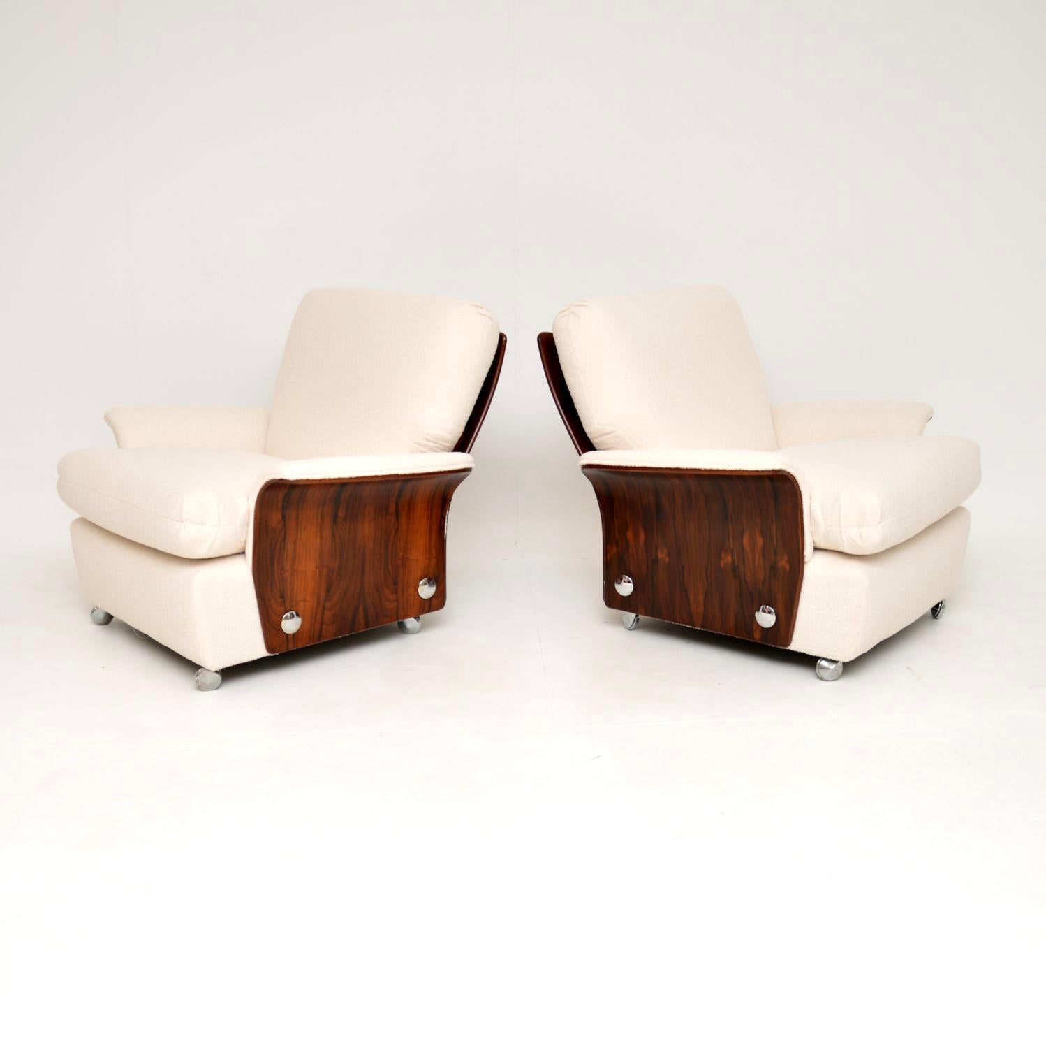 A stylish and very rare pair of rosewood armchairs by G Plan. They were designed as part of the ‘Tulip Group’ by KM Wilkins. They were made in England and date from the 1960’s.

The design is stunning, with beautiful rosewood panels on the sides and