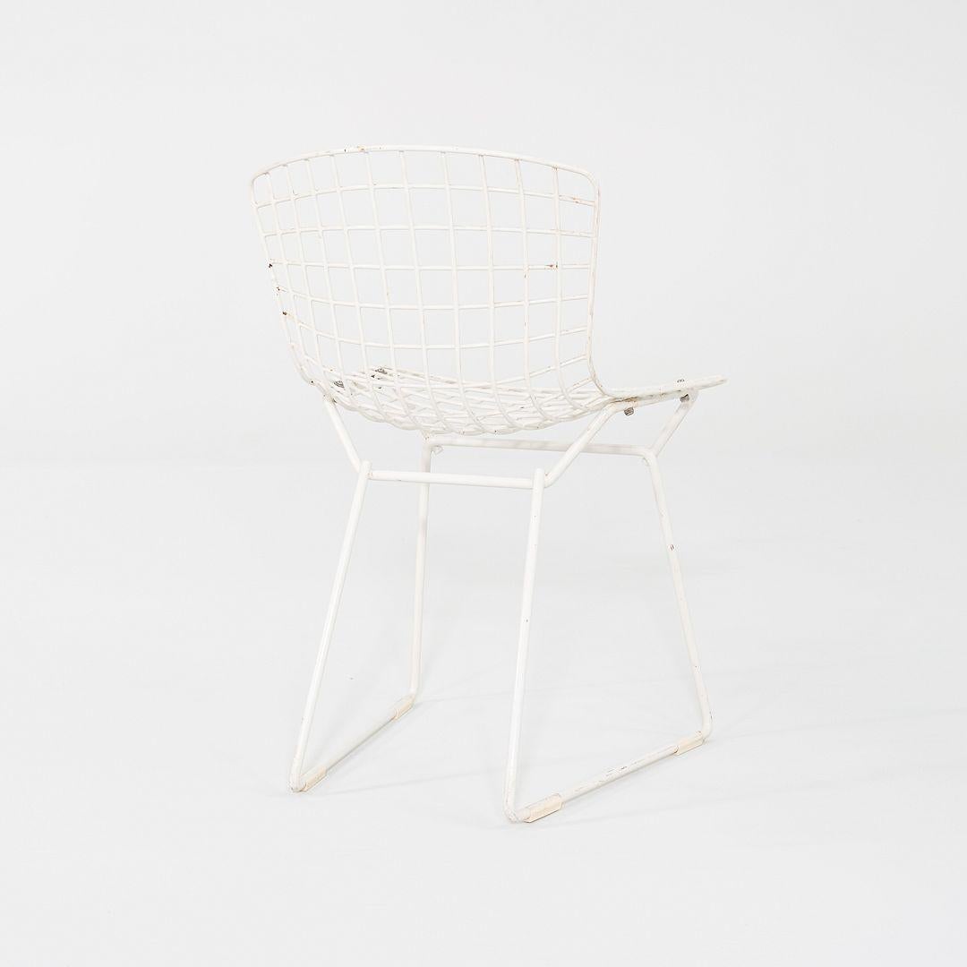 This is a pair of Child's Bertoia Side Chairs, originally designed by Harry Bertoia in 1955. These particular examples were produced by Knoll in the USA in the 1960s. The design is comprised of welded steel rods. The finish appears to be more