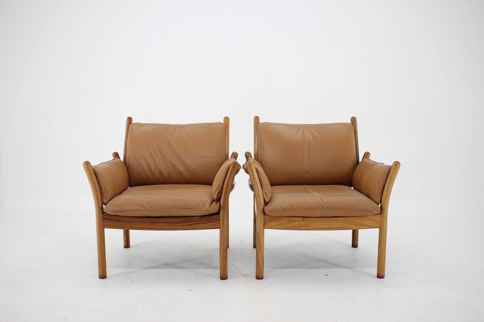 1960s Pair of Illum Wikkelsø Genius Leather Palisander Armchairs with Stools, De 1