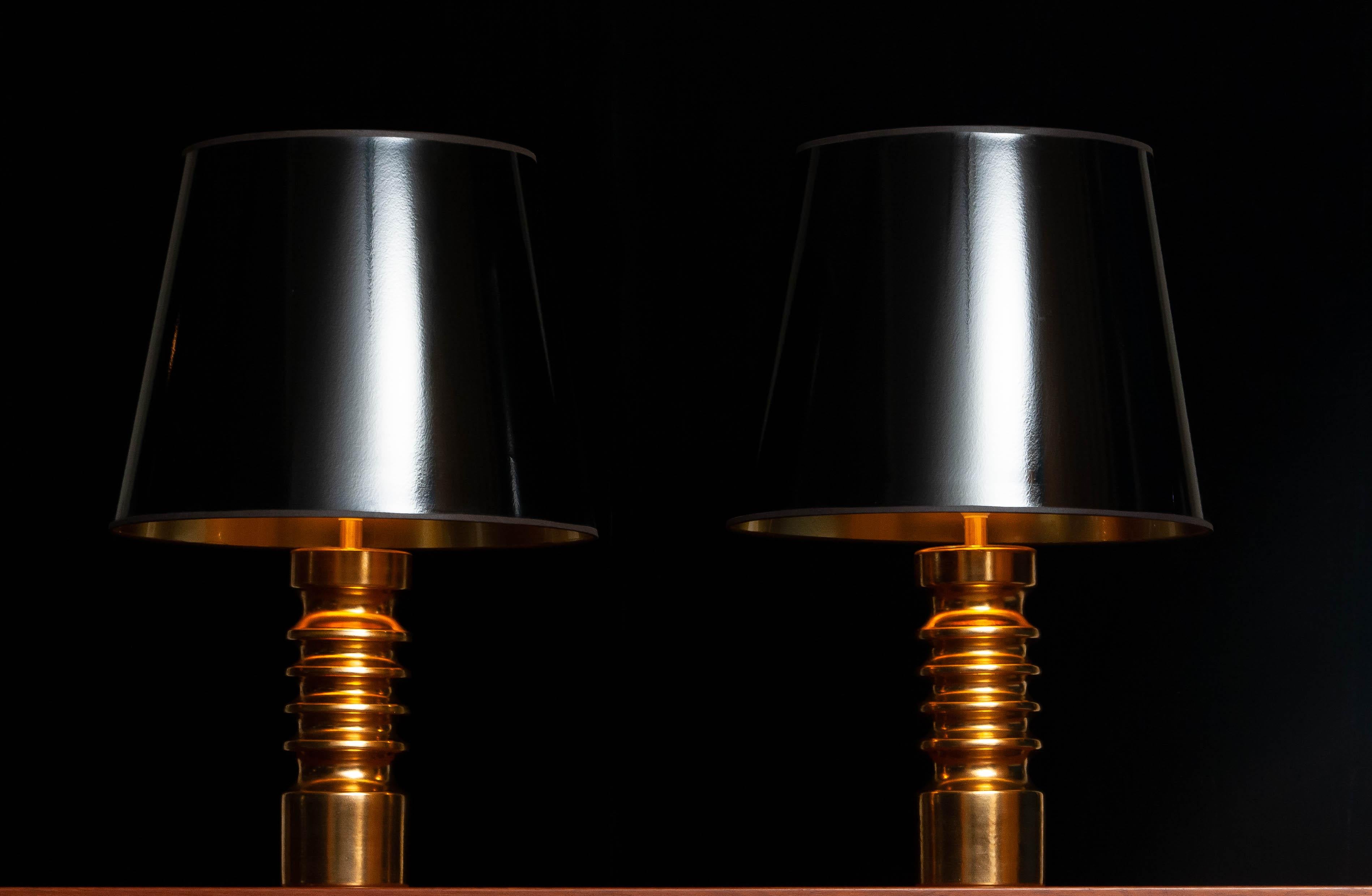 Absolutely fantastic pair golden table lamps attributed to Bitossi Italy. These lamps are from the '60s and in overall very good condition.
In combination with the black shades they make a great impression. The black shades are from a later period