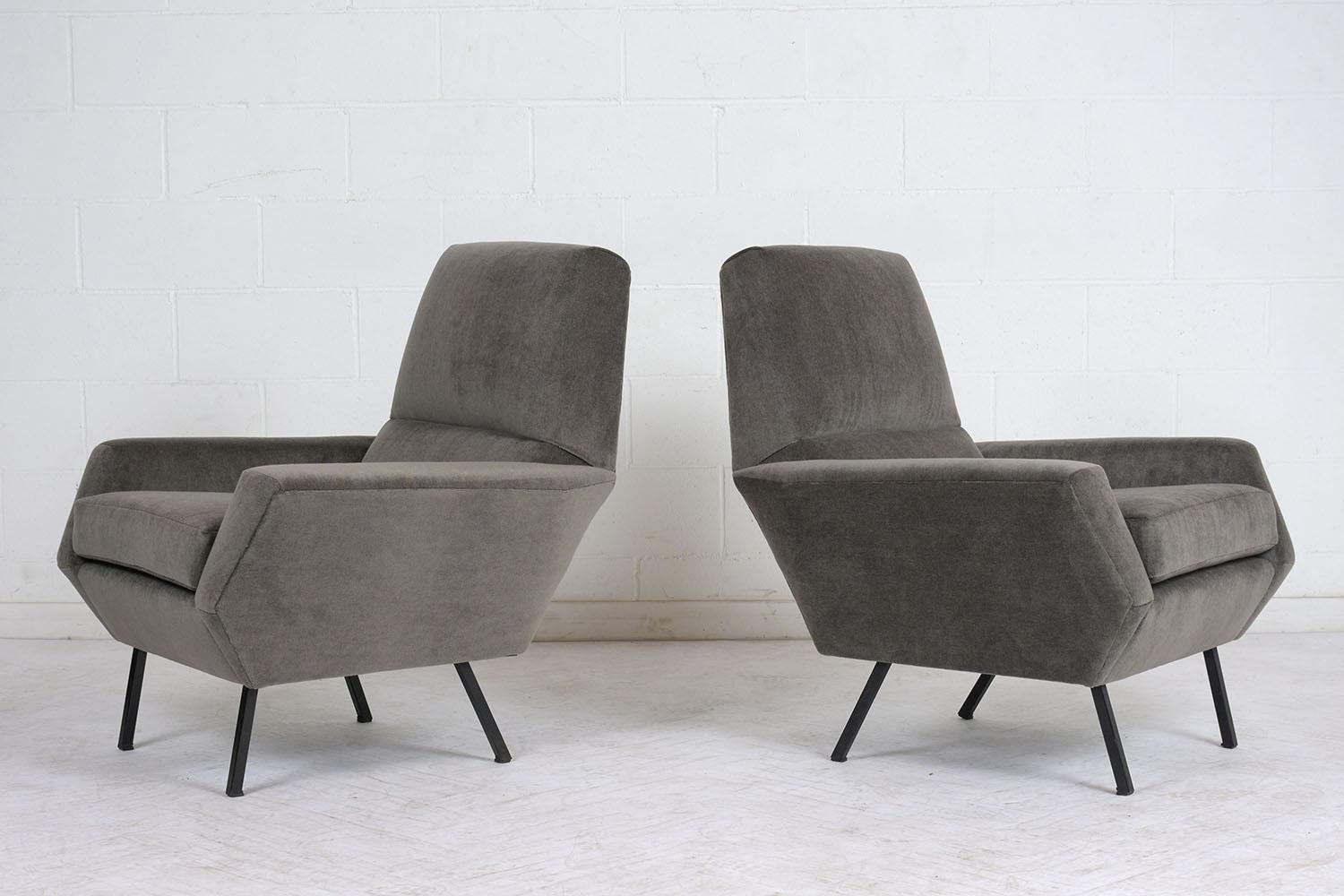 This pair of 1960s Italian Mid-Century Modern style bergères have been completely restored. The single cushion chairs have new foam cushions throughout and have been professionally upholstered in a dark gray color Mohair fabric. The bergères feature