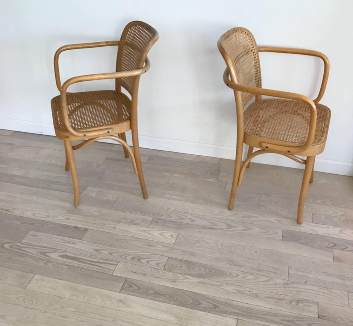 Josef Hoffmann 811 Prague chairs with bentwood arms and cane back and seats. Made in Poland, 1960s, Thonet. Excellent condition. Love these! So classic and timeless. Sold as a pair of two chairs only. All cane intact. Hand canning.
Minor scuff on