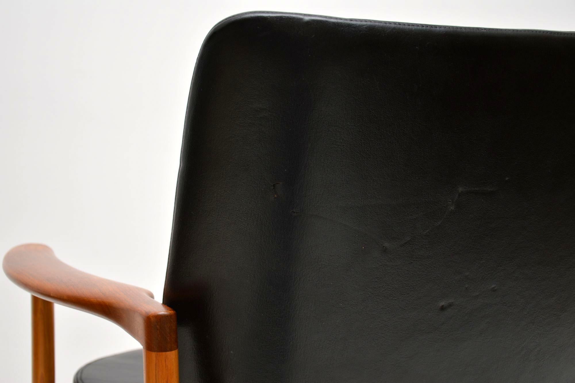 1960s Pair of Leather and Walnut Armchairs by IB Kofod Larsen 4