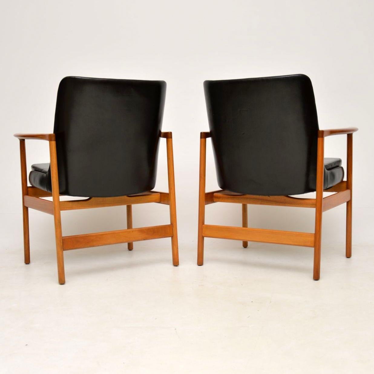 Mid-20th Century 1960s Pair of Leather and Walnut Armchairs by IB Kofod Larsen