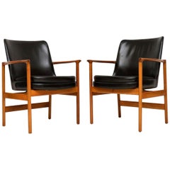 1960s Pair of Leather and Walnut Armchairs by IB Kofod Larsen
