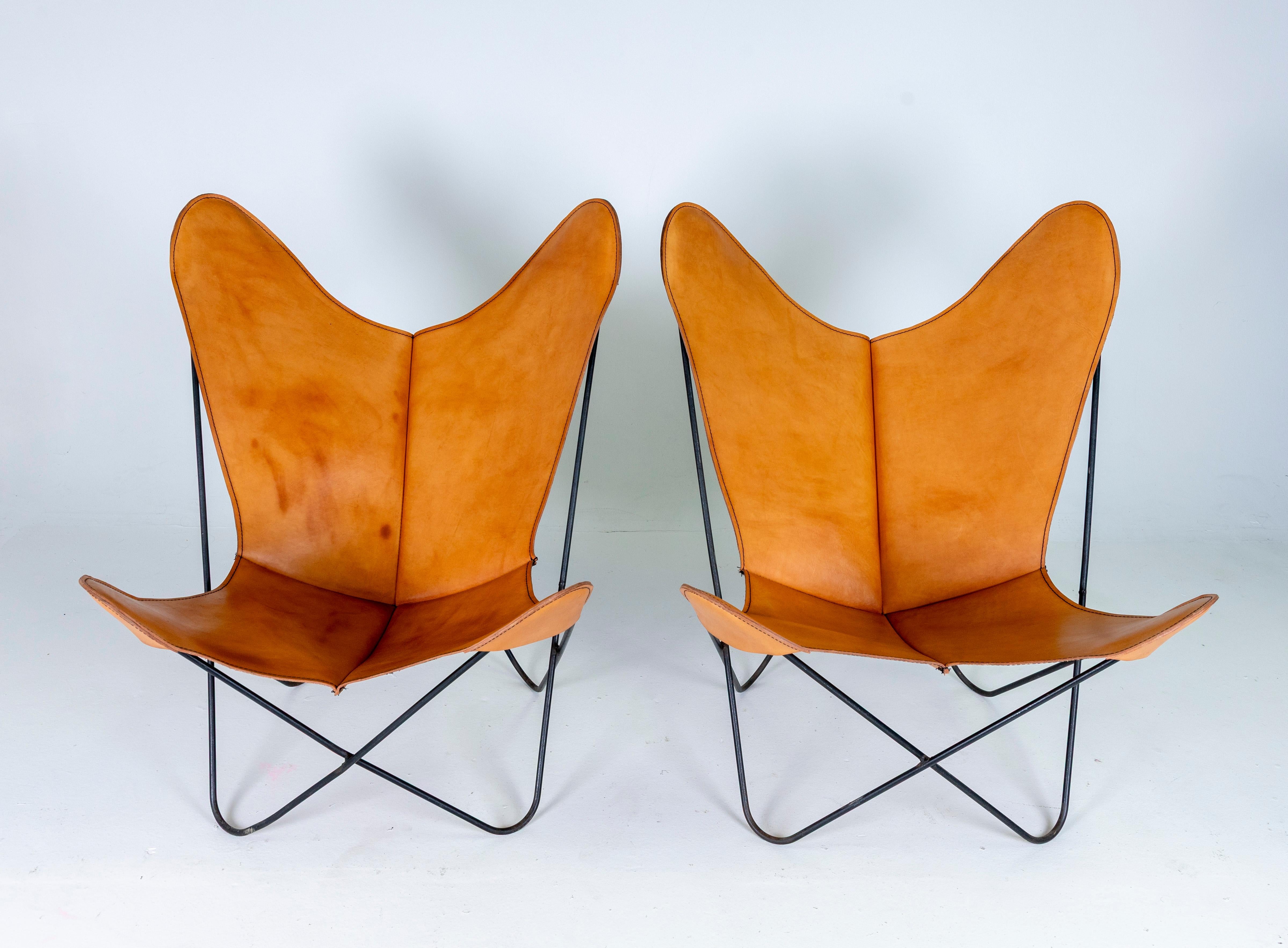1960s Beautiful Pair of Leather Butterfly Chairs by Jorge Ferrari Hardoy Bonet and Kurchan. Black Iron base in original condition, Veg Tan Leather was replaced at some point. 
Great condition, no damages, just normal wear. The Leather is very