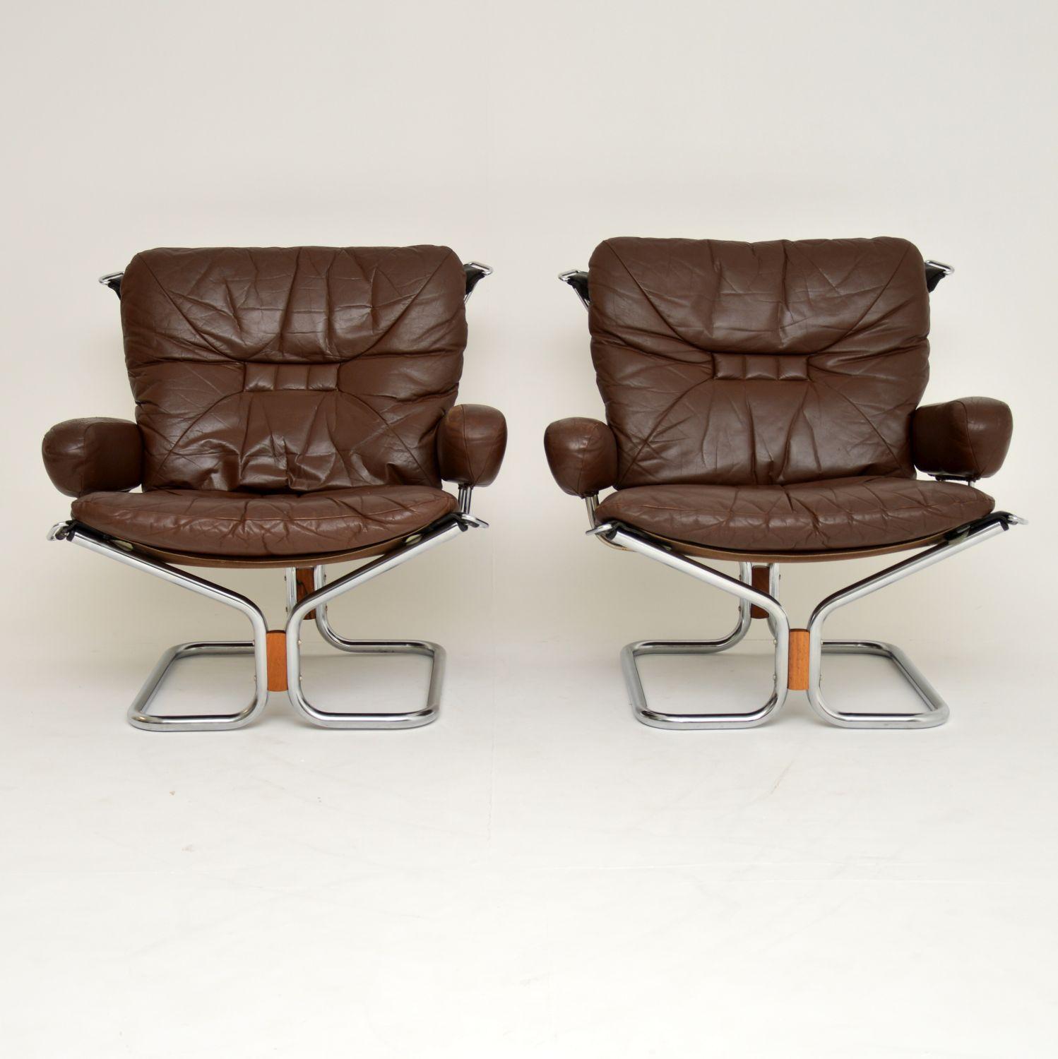A stunning pair of vintage armchairs in leather, chrome and wood. These were designed by Ingmar Relling, they were made in Norway. They date from the 1960s-1970s, and are in lovely original condition. The leather has some minor surface wear, mostly