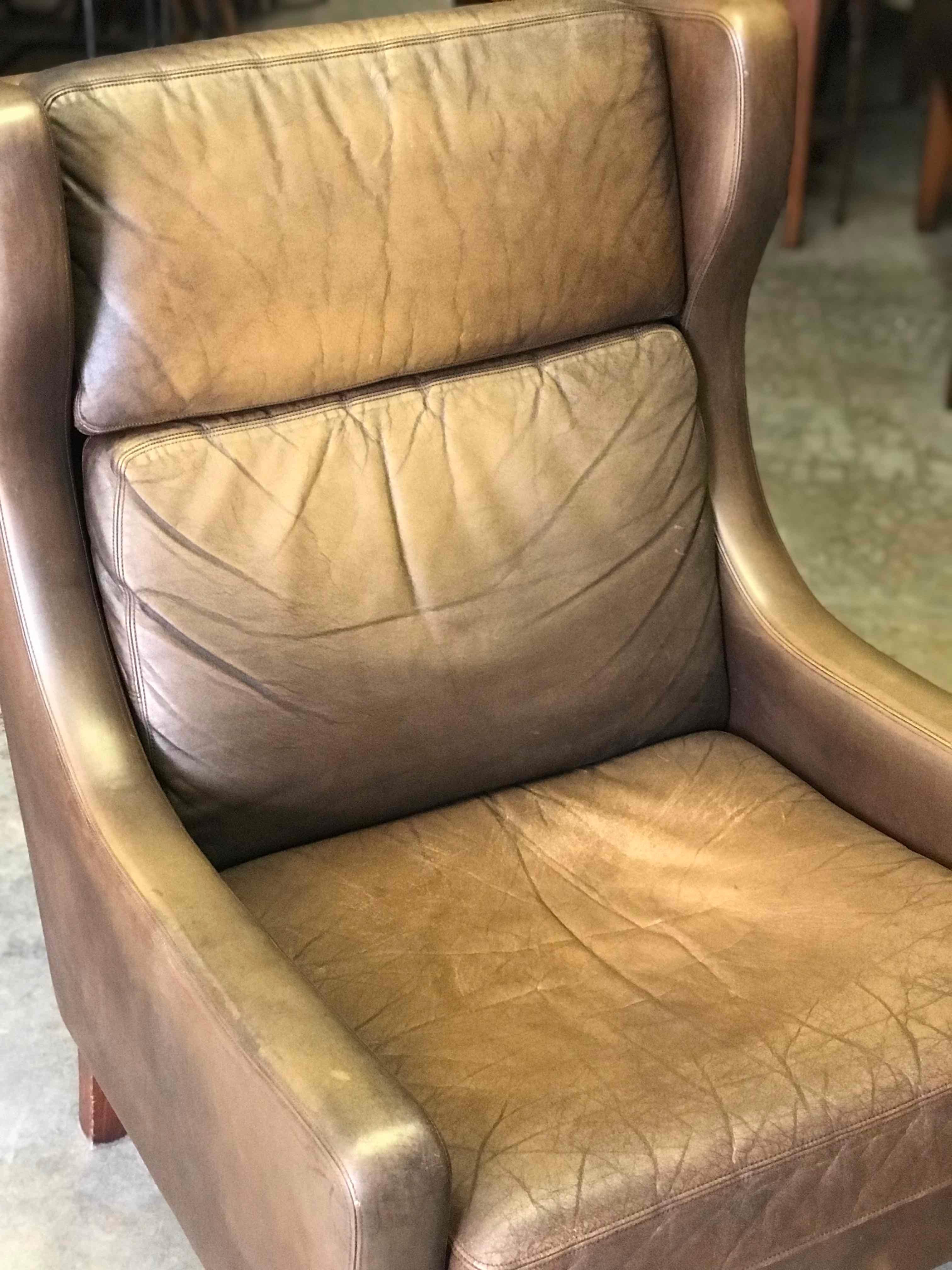 1960s pair of leather mid-century Scandinavian wing armchairs. 