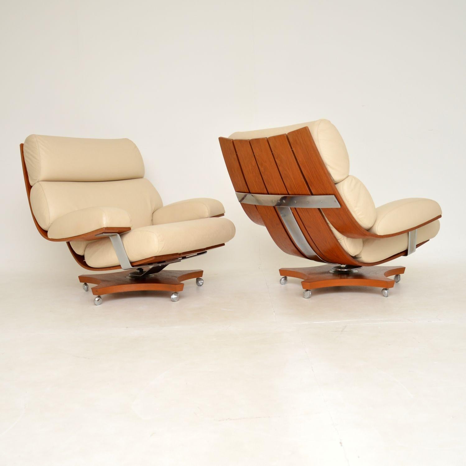 A stunning and exceptionally comfortable pair of vintage cream leather and teak Housemaster armchairs by G Plan. These were designed by KM Wilkins, they were made in England and date from the 1970’s.

This model is very rare and hard to find, to