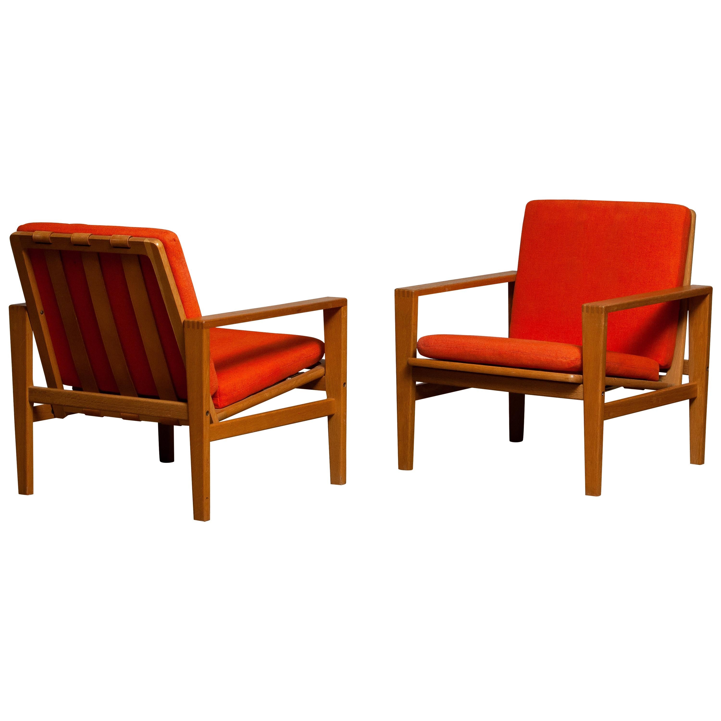 Comfortable Scandinavian set of two lounge chairs designed by Erik Merthen for Ire Skillingaryd, Sweden, 1960s.
The oak frames are in perfect condition as well as the leather belts who supports the backrest. The cushions have been newly