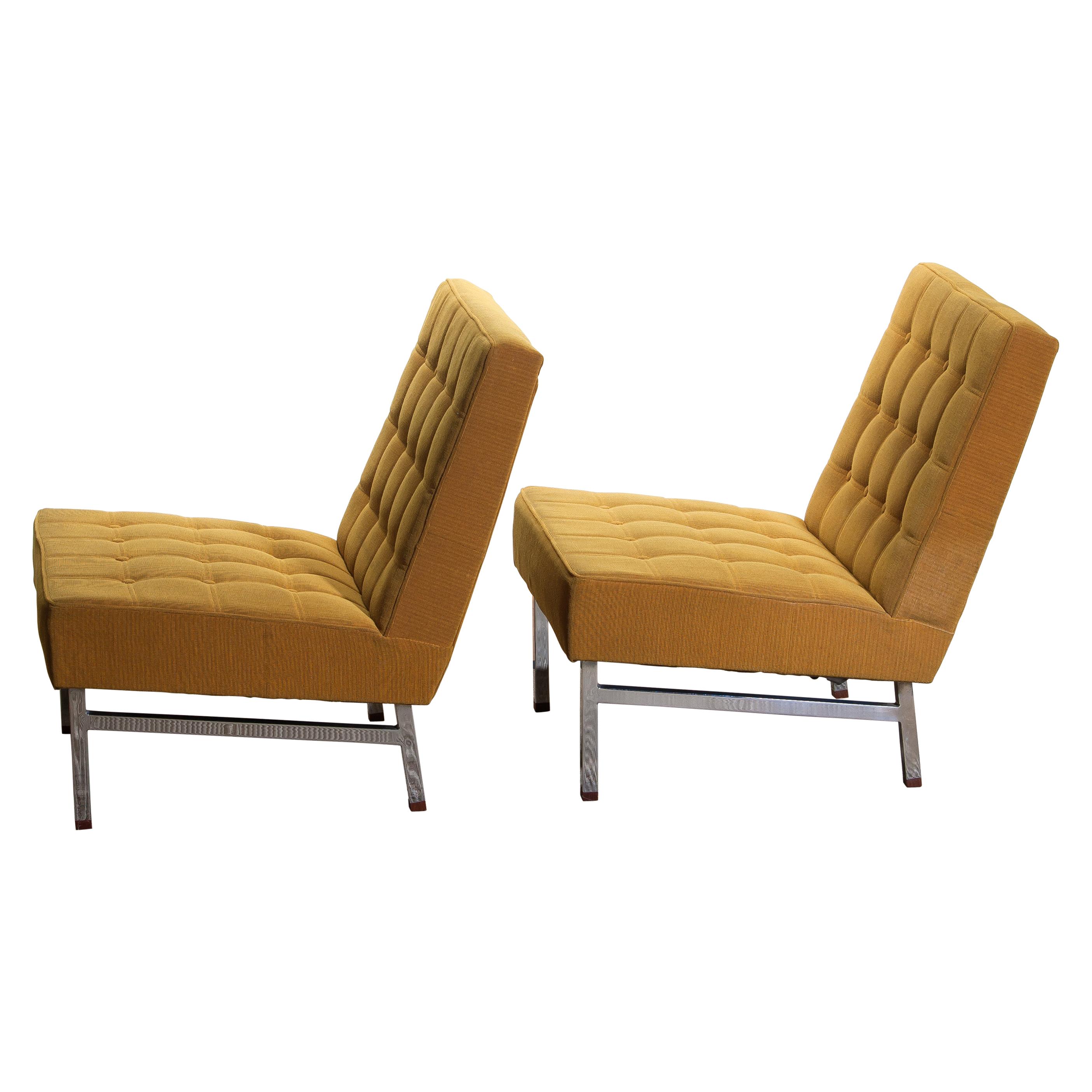 1960, set of two comfortable and extremely rare lounge chairs designed by Karl Erik Ekselius for JOC Möbler Vetlanda, Sweden.
Both chairs are original and in good condition. Somewhat dry filling.
Stands are made of chromed metal with teak ends.
  