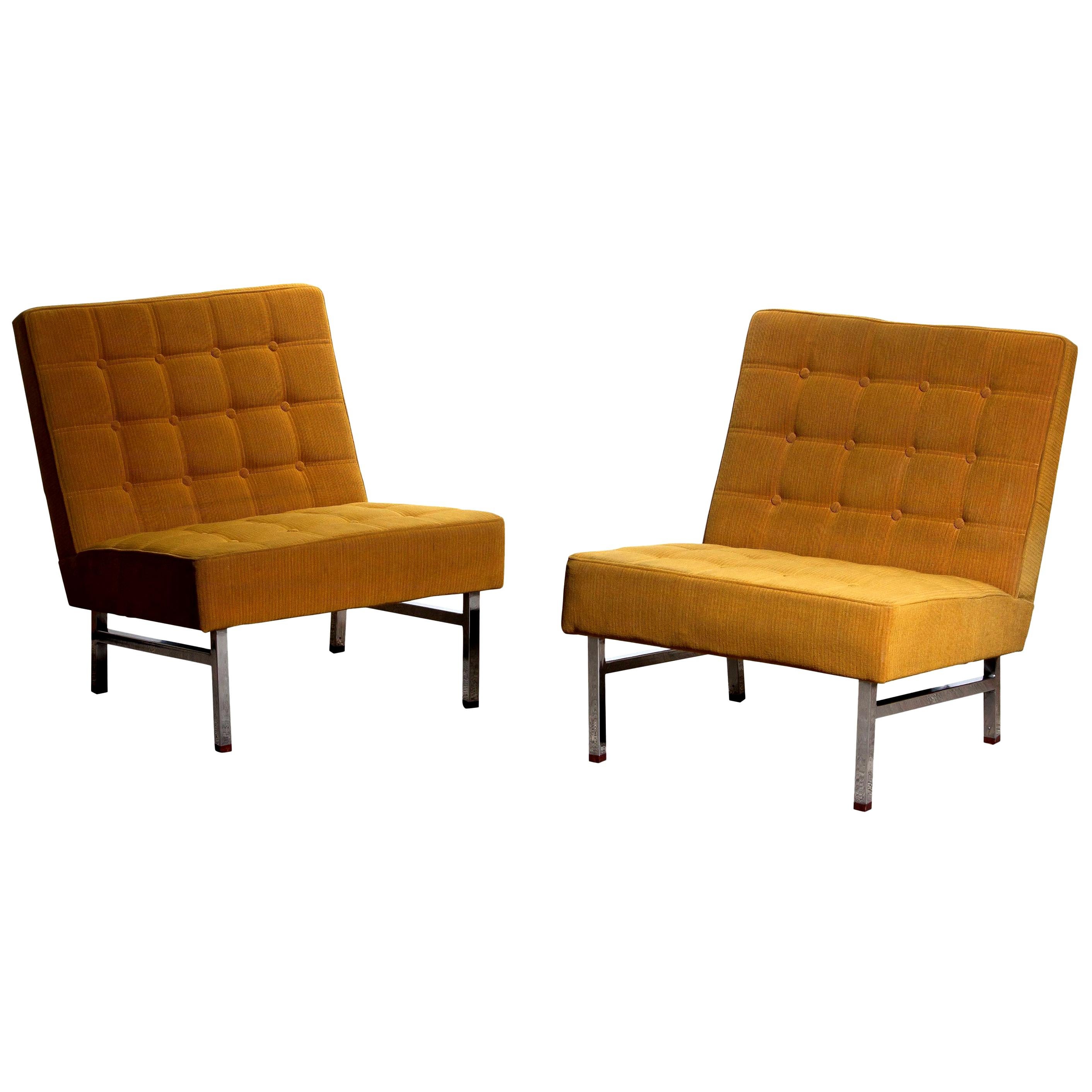 1960, set of two comfortable and extremely rare lounge chairs designed by Karl Erik Ekselius for JOC Möbler Vetlanda, Sweden.
Both chairs are original and in good condition. Somewhat dry filling.
Stands are made of chromed metal with teak ends.
 