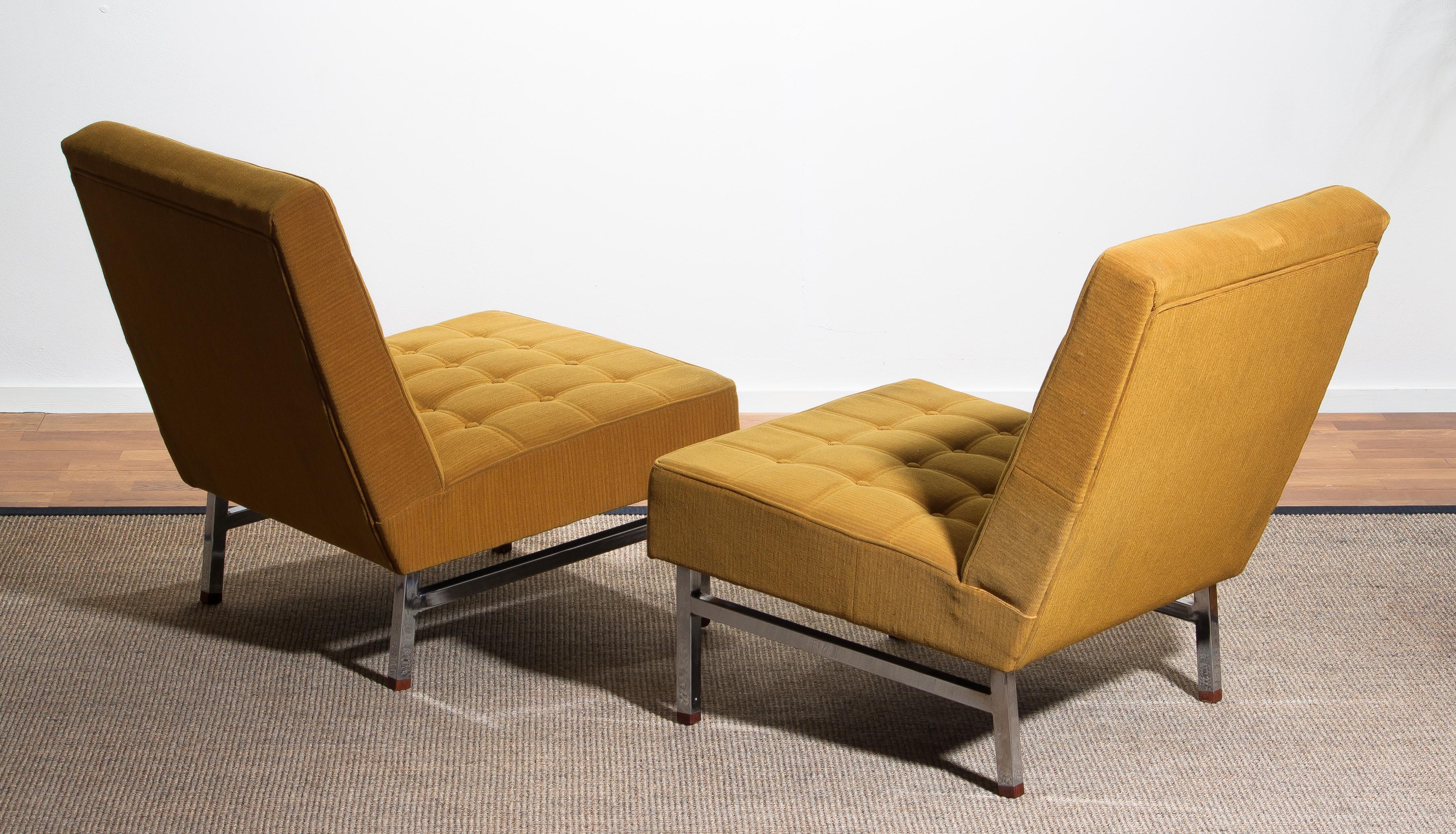 1960, set of two comfortable and extremely rare lounge chairs designed by Karl Erik Ekselius for JOC Möbler Vetlanda, Sweden.
Both chairs are original and in good condition. Somewhat dry filling.
Stands are made of chromed metal with teak ends.
  
